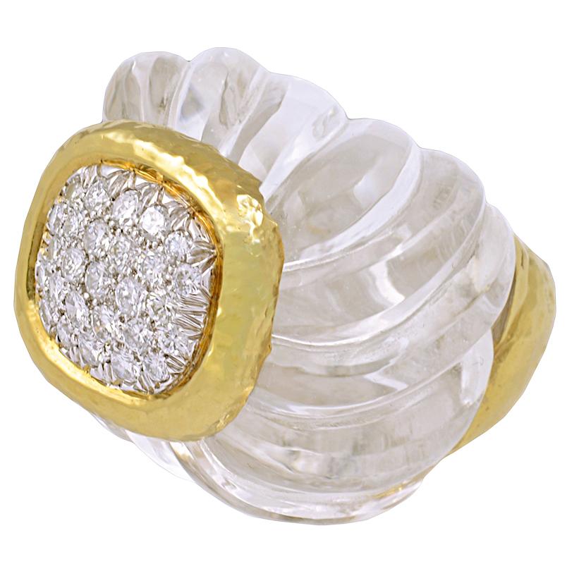 A 1980's vintage David Webb carved rock crystal and diamond ring, set at the centre with a cluster of brilliant-cut diamonds within a hammered gold surrounds. Size 4 1/2

Signed David Webb.