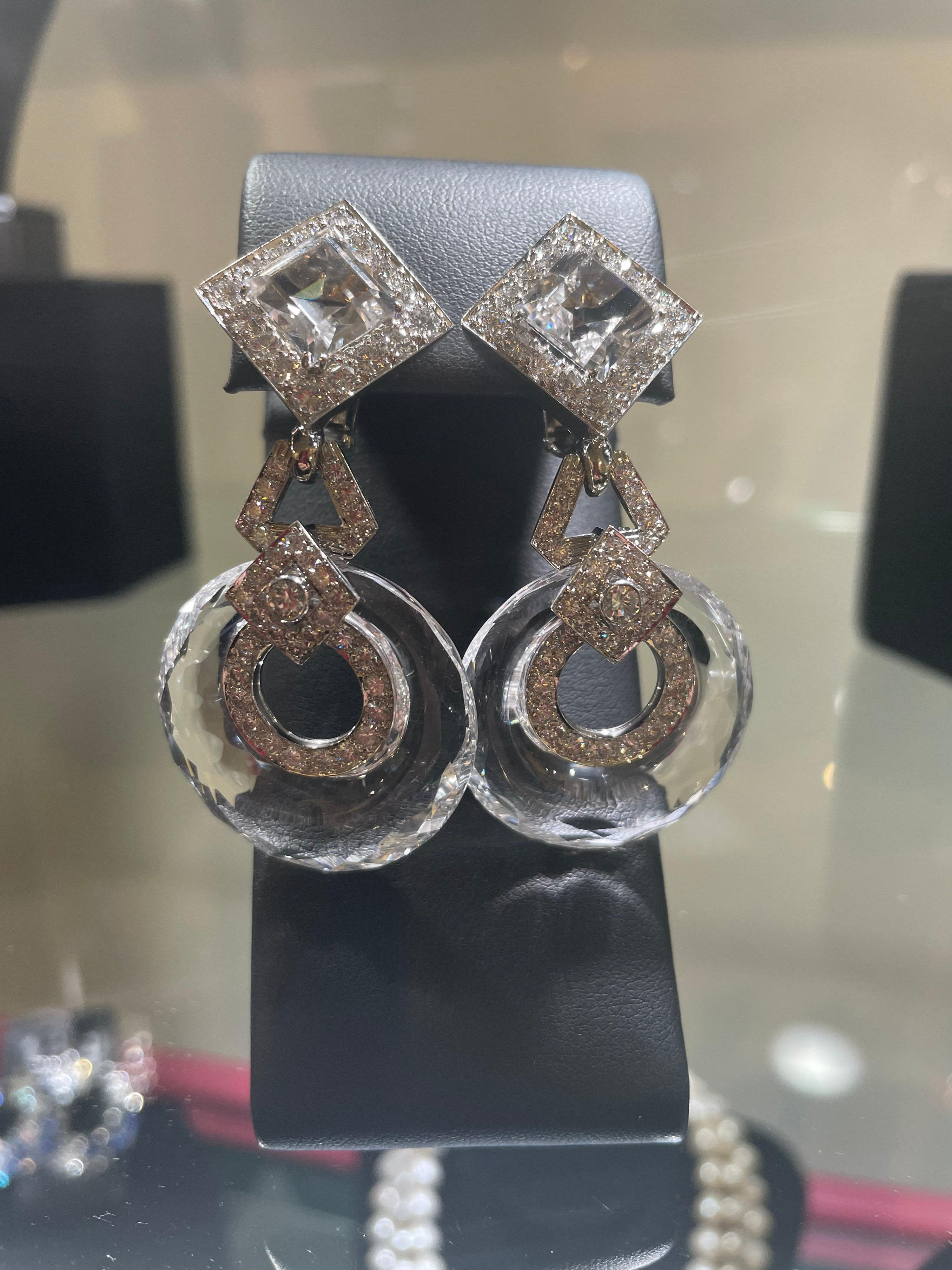 Classic David Webb earrings with COA from David Webb.
These Rock Crystal earrings are stunning with hoop drops and diamond accents