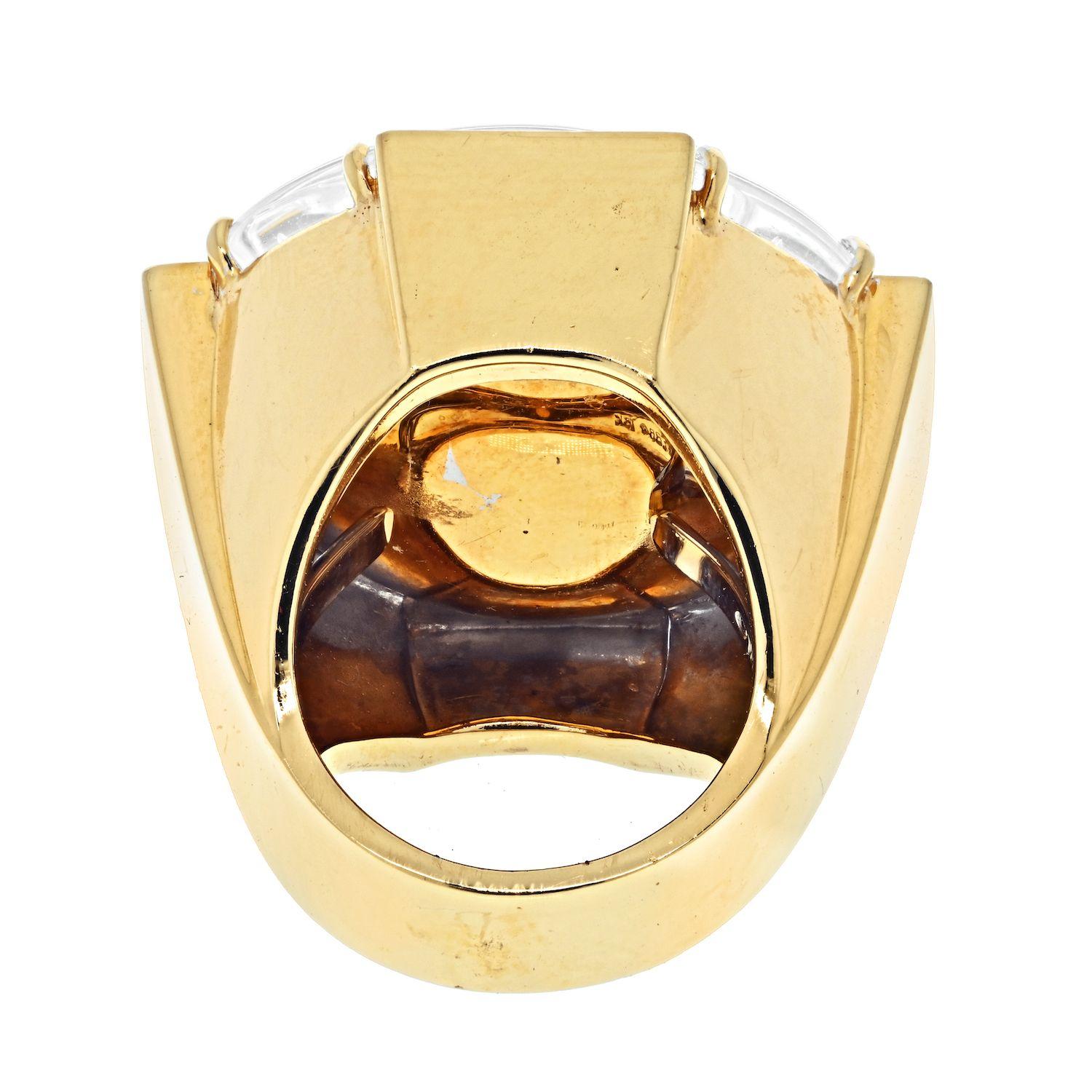One of a kind David Webb octagonal rock crystal and diamond ring made in 18k yellow gold with diamond accents on north south east west framing bars.
Ring size 6
Overall about 1 inch wide.