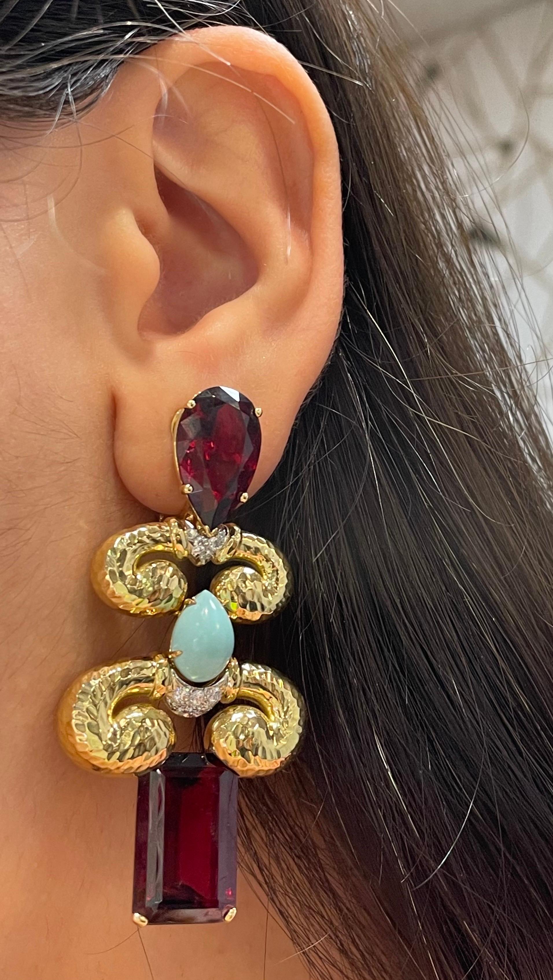 David Webb Rubellite & Turquoise Diamond Necklace & Earrings Set.

A necklace featuring step-cut and oval rubellite, cabochon turquoise, brilliant-cut diamonds weighing approximately 7.26 carats, set in 18K gold, and platinum with hammered gold