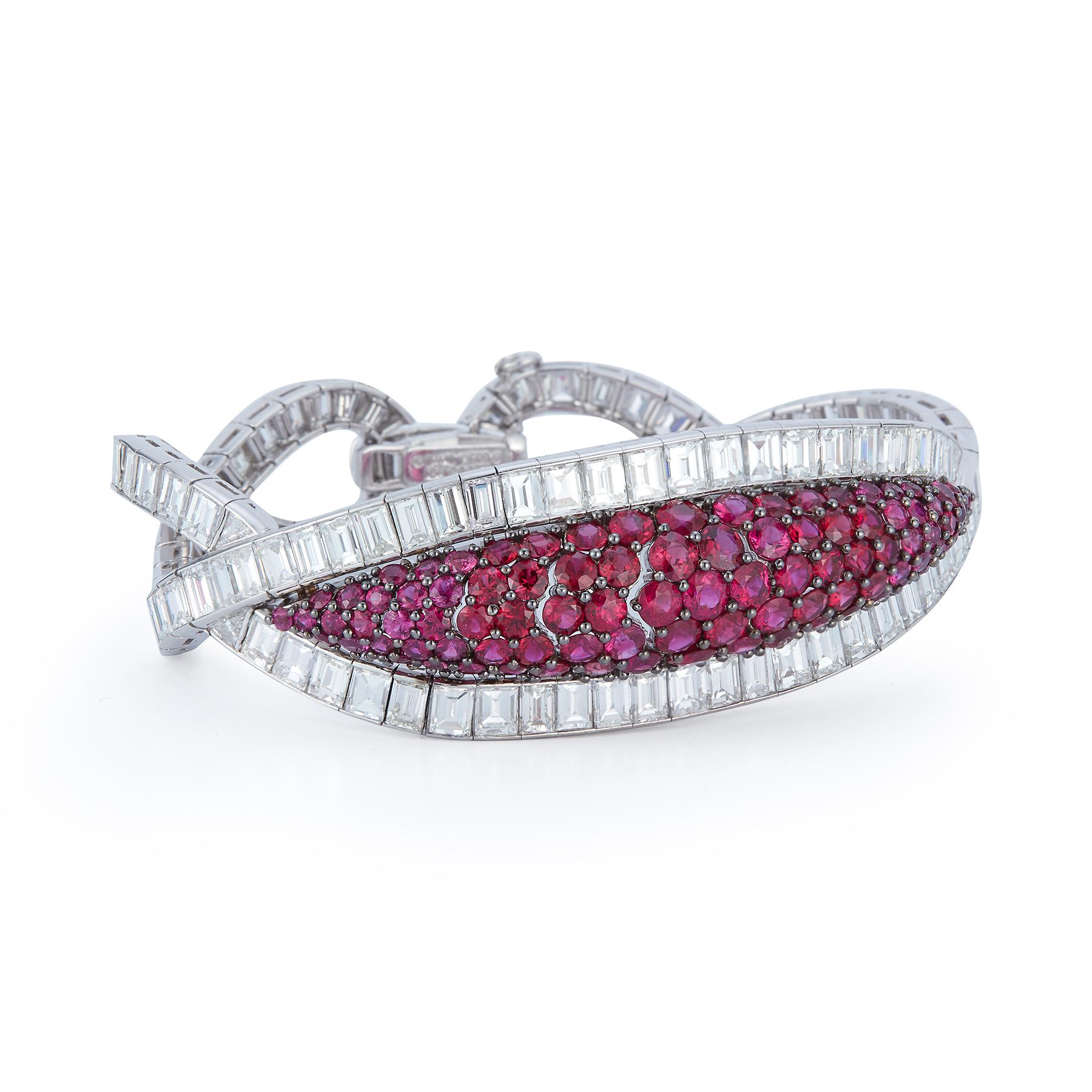 Magnificent Ruby and Diamond Bracelet by David Webb

A extremely fine vintage ruby and diamond bracelet made by David Webb

Set with approximately 45 carats of very fine colorless diamonds and pave set rubies in the center.

Made circa 1970

With
