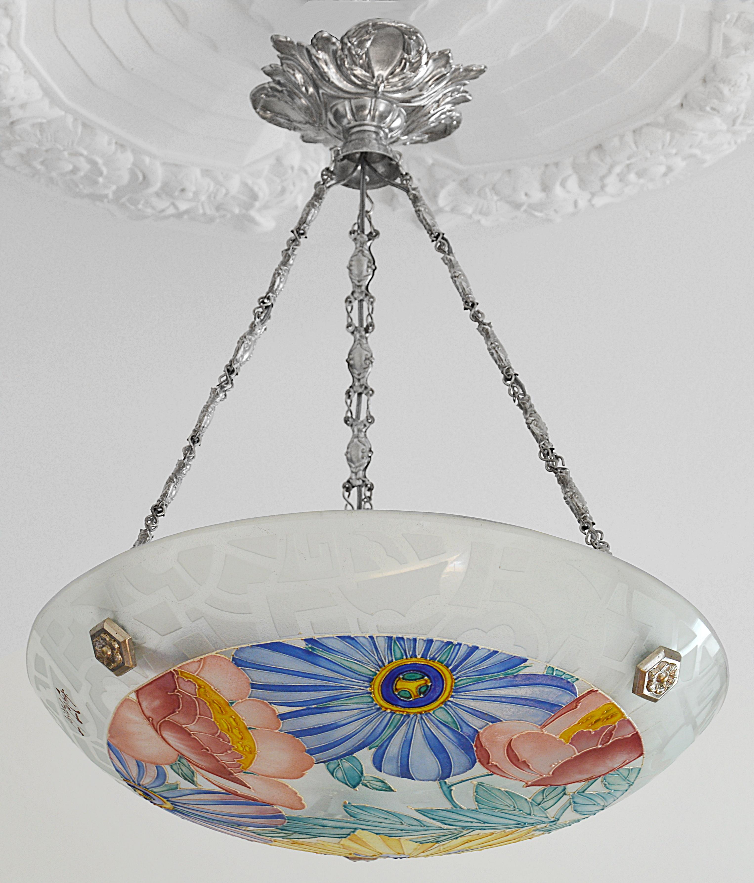French Art Deco chandelier by Loys Lucha, Nancy and Billancourt (Paris), ca.1925. Enameled glass shade hung at its original stamped plated metal fixture. The edge of the shade is acid-etched. Signed 