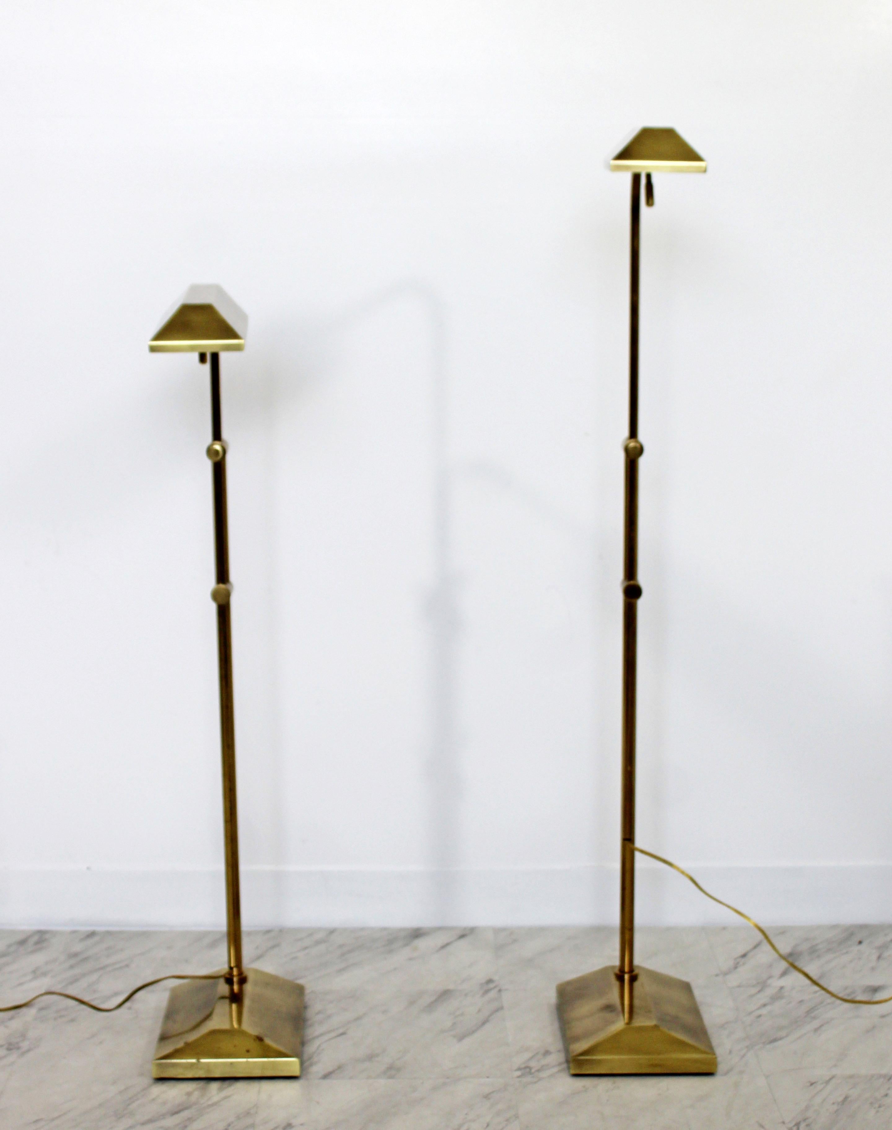 For your consideration is a wonderful, pair of brass floor lamps, with adjustable heights and heads, in the Pharmacy style, by Frederick Cooper, circa the 1970s. In very good condition, with a patina to match age and use. The dimensions are 20