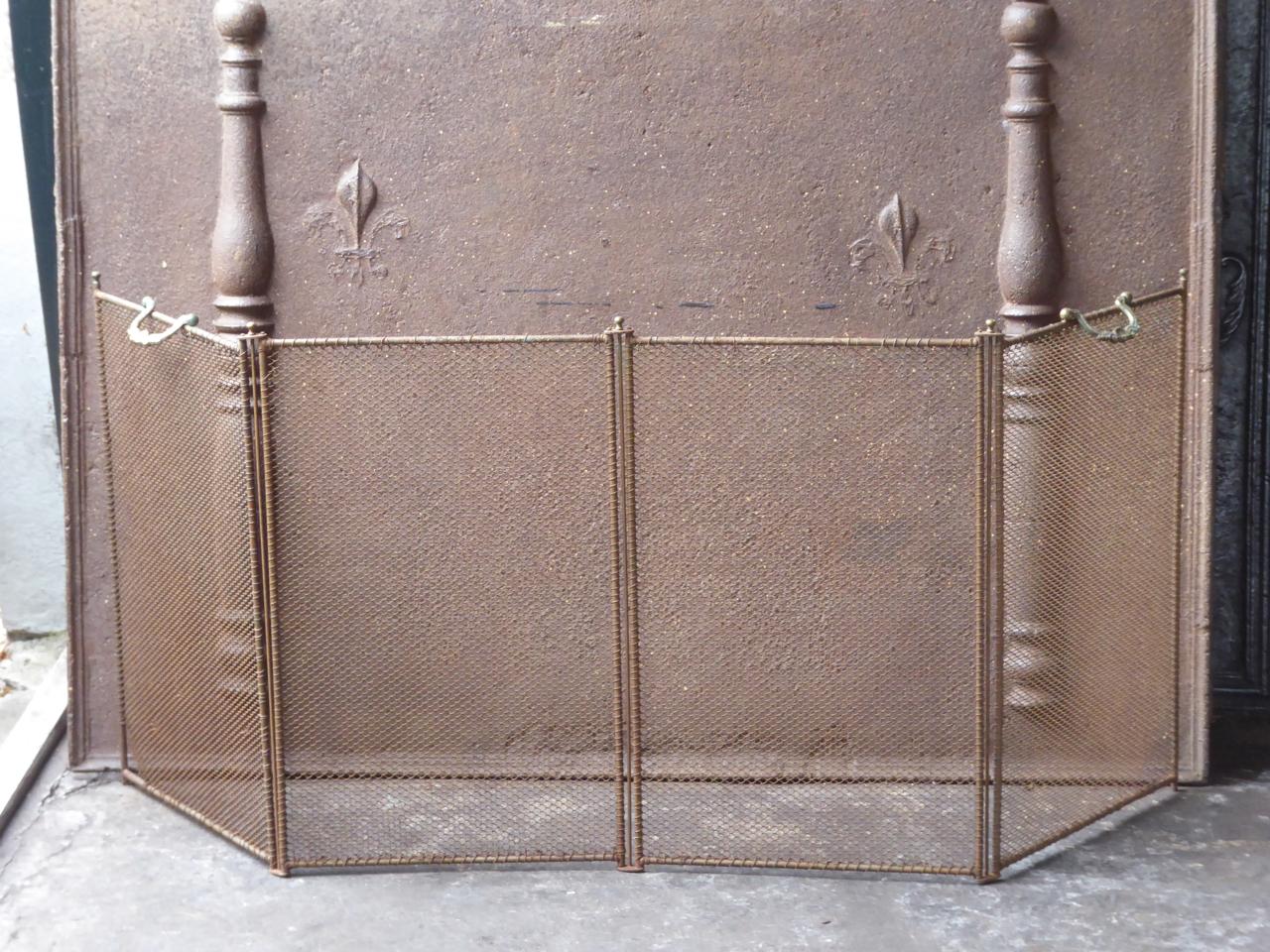 19th century French Napoleon III fireplace screen. The screen is made of iron and iron mesh.

We have a unique and specialized collection of antique and used fireplace accessories consisting of more than 1000 listings at 1stdibs. Amongst others,