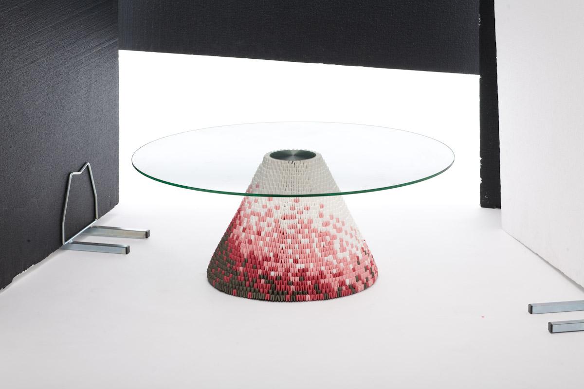 These remarkable glass topped tables utilize a unique and ancient oriental process of interlocking folded paper. Individual paper components knitted together form the table base and create engaging visual patterns and textures whilst also providing