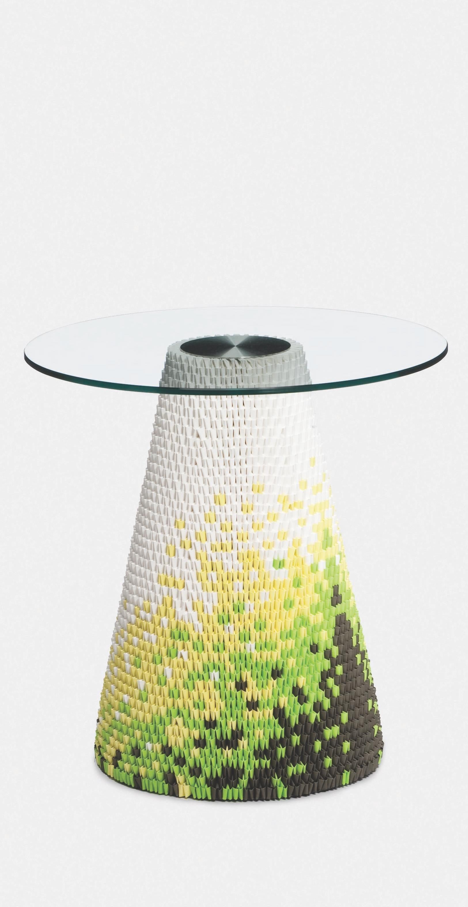 These remarkable glass topped tables utilize a unique and ancient oriental process of interlocking folded paper. Individual paper components knitted together form the table base and create engaging visual patterns and textures whilst also providing