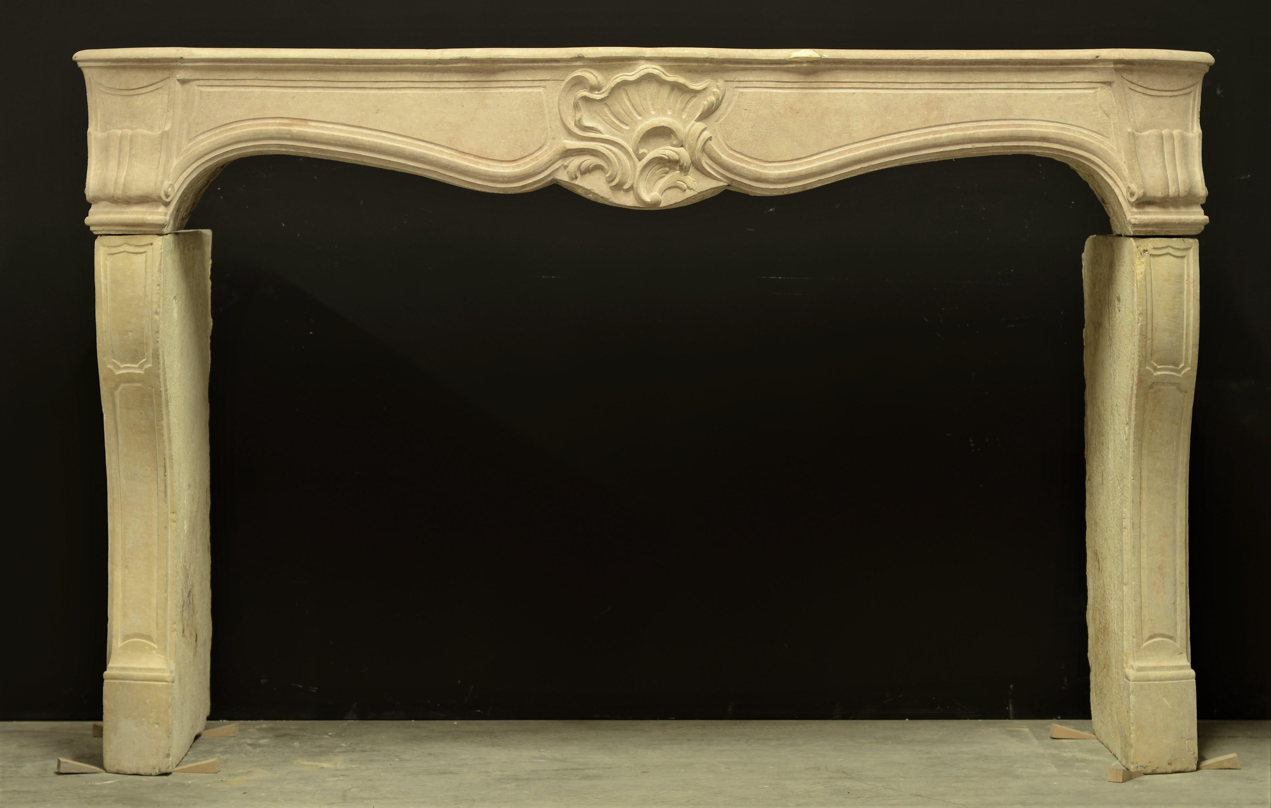 Beautiful antique French Louis XV fireplace mantel executed in limestone.
Nice soft tones and fine carvings.

Nice original condition.

Sold by Schermerhorn Antique Fireplaces.