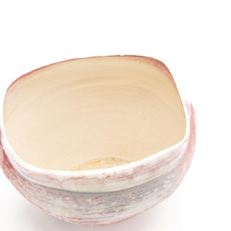 Contemporary Japanese studio vase. Signed.
Swathed in hues reminiscent of the contents of Marie Antoinette's powder box. A collar of high glaze flows down from the neck to be met by the chalky, finely abrasive texture of the body, splattered and