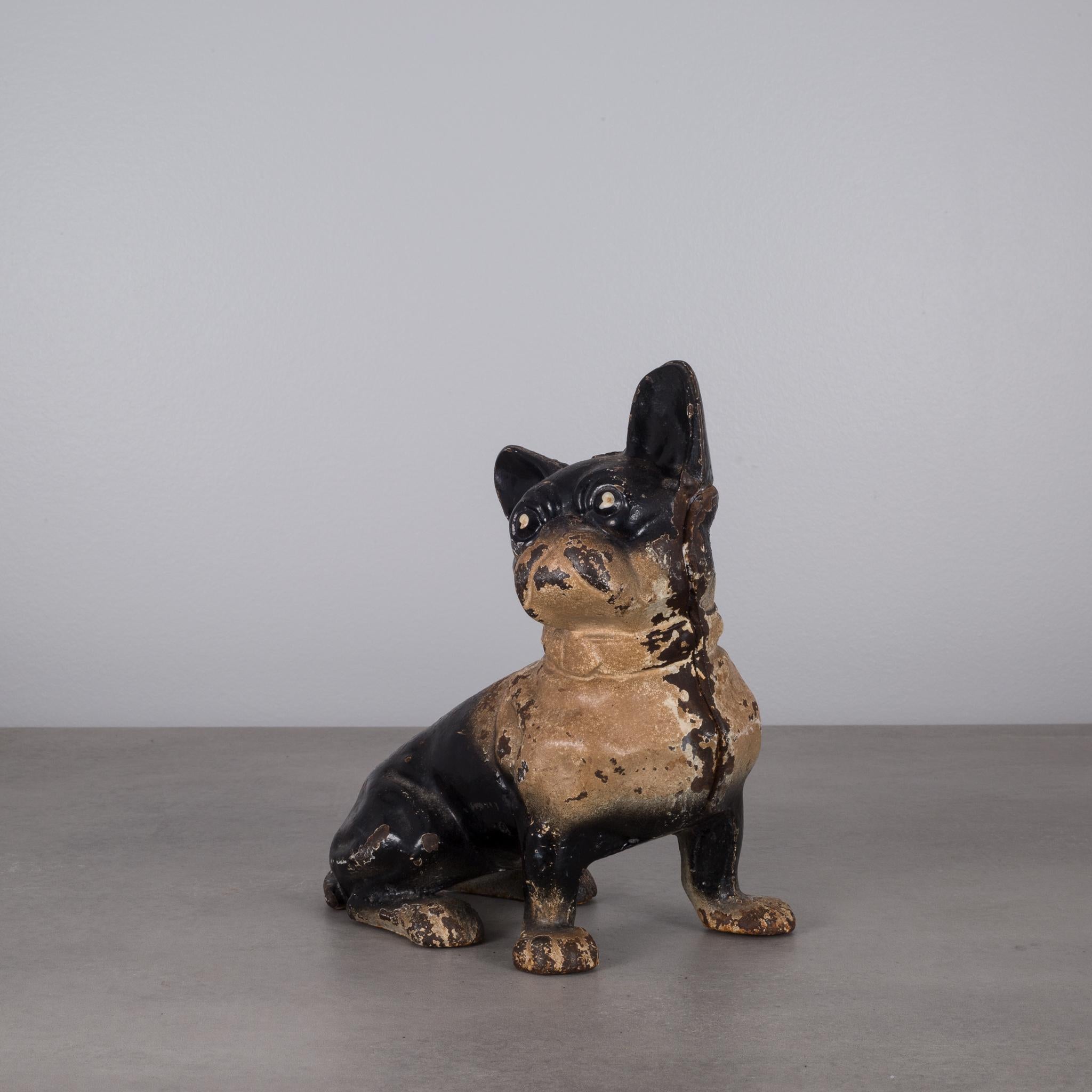 This is an original cast iron French Bulldog doorstop manufactured by the Hubley Manufacturing Company in Lancaster Pennsylvania USA. The piece has retained its original hand painted finish and is in excellent condition with the appropriate patina