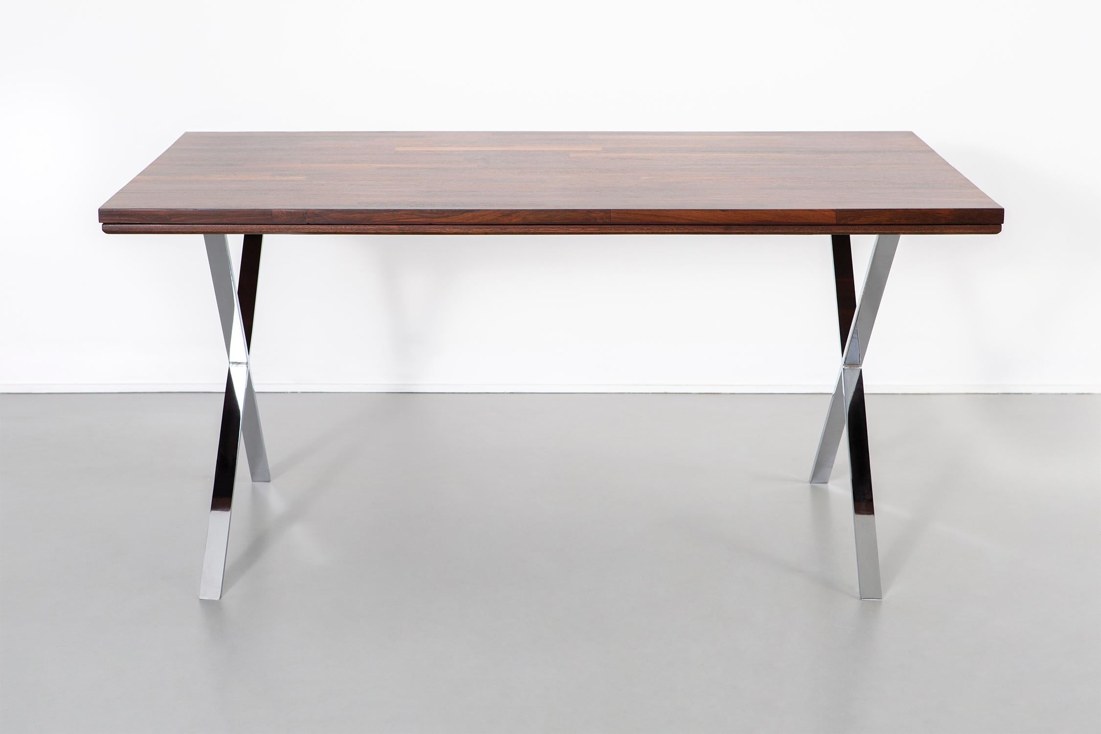 Campaign desk.

by Dave Parmelee for Founders

USA, circa 1970s.

Rosewood and chrome.

Measures: 29 ¾” H x 60” W x 35 ¾” D.