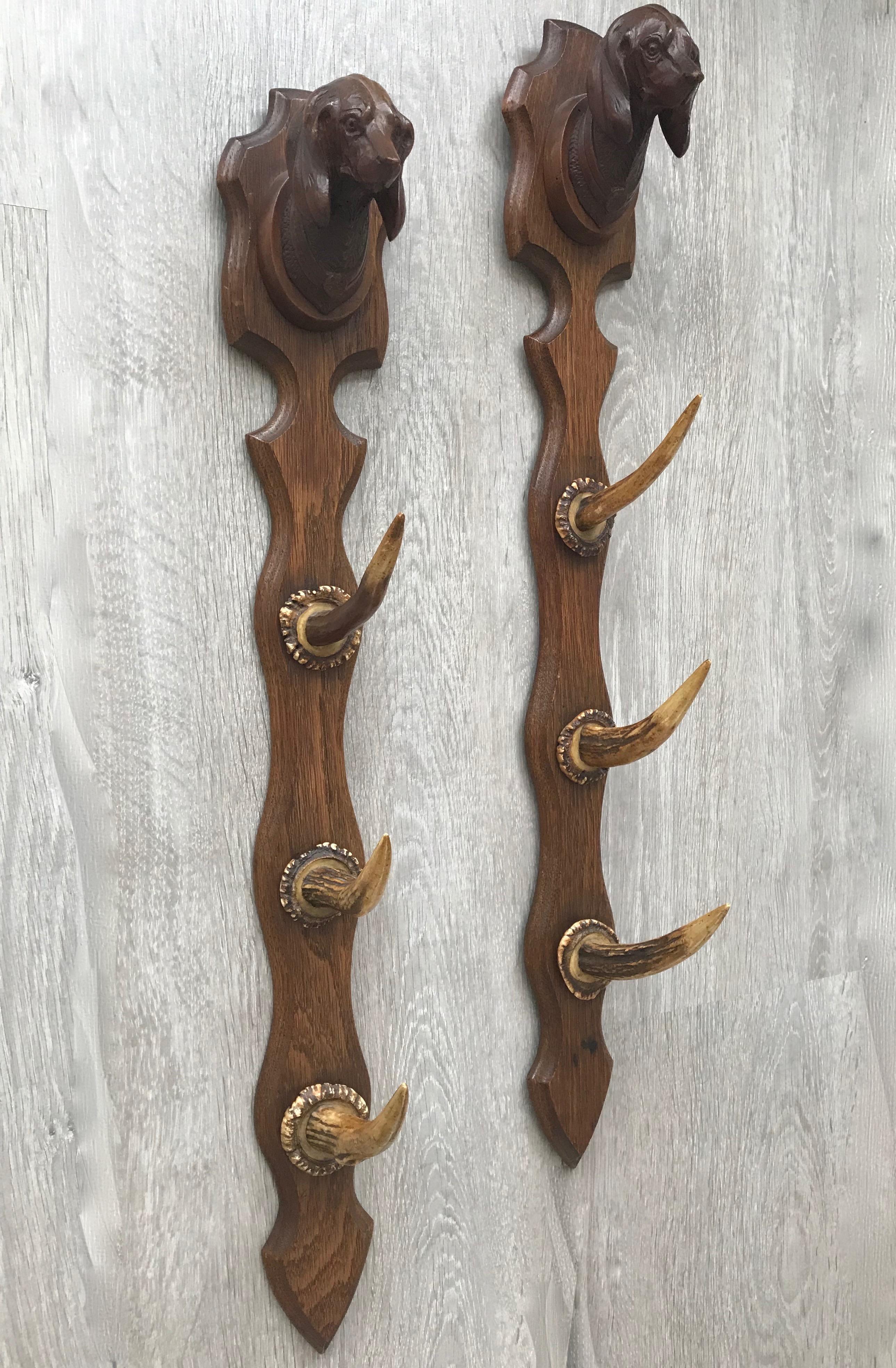 Unique rifle rack with very cool and highly decorative pair of dachshund sculptures.

This highly decorative and great condition set for wall mounting together create the perfect rifle rack. On top they each come with a beautiful and all hand-carved