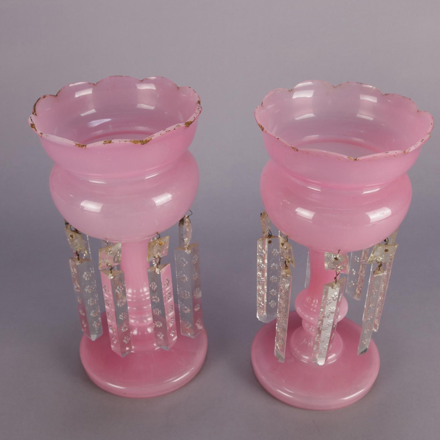 Antique Victorian pair of pink Bristol glass mantel luster’s with ruffled rims, gilt highlights and cut crystal hanging prisms, circa 1890.

Measures: 12