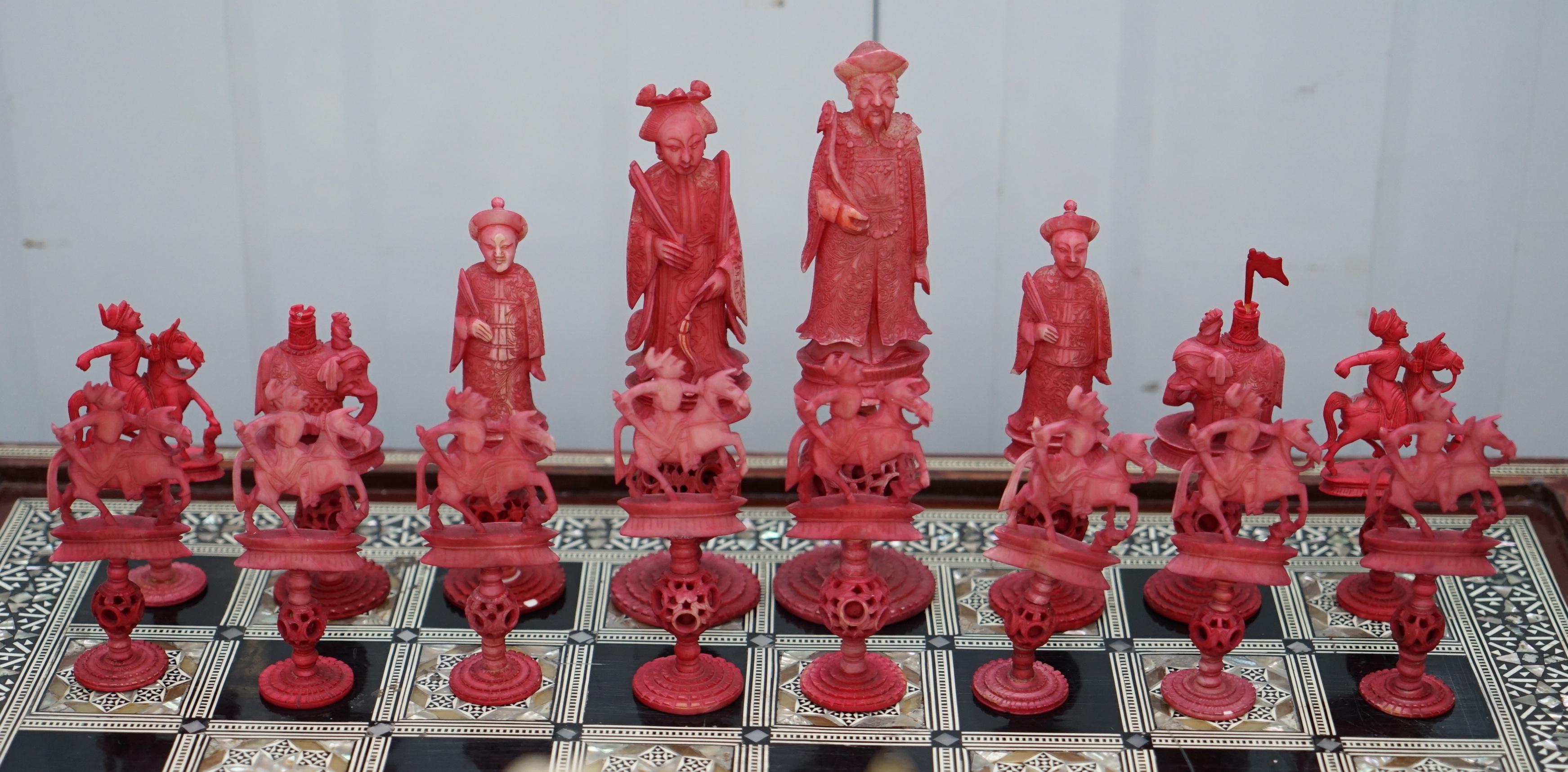 We are delighted to offer for sale this lovely very rare 19th-century hand-carved Chinese puzzle ball chess set

The chess pieces are totally original and very rare finds, this set is known as the puzzle ball set because no one knows how they