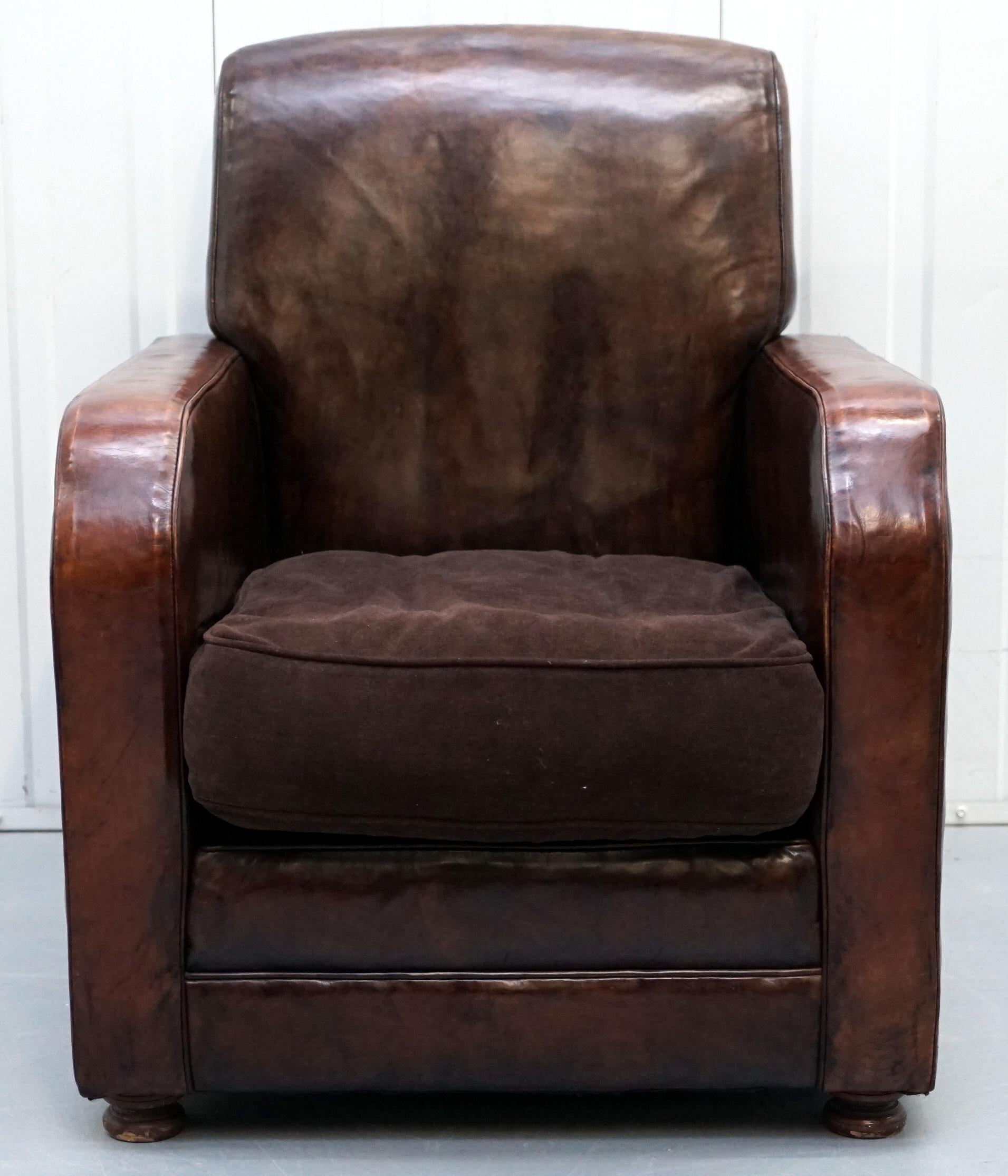 We are delighted to offer for sale this lovely hand dyed aged brown leather coil sprung club armchair with velvet feather filled cushion

A very well made and exceptionally comfortable club armchair, the velvet cushion is what’s called a summer