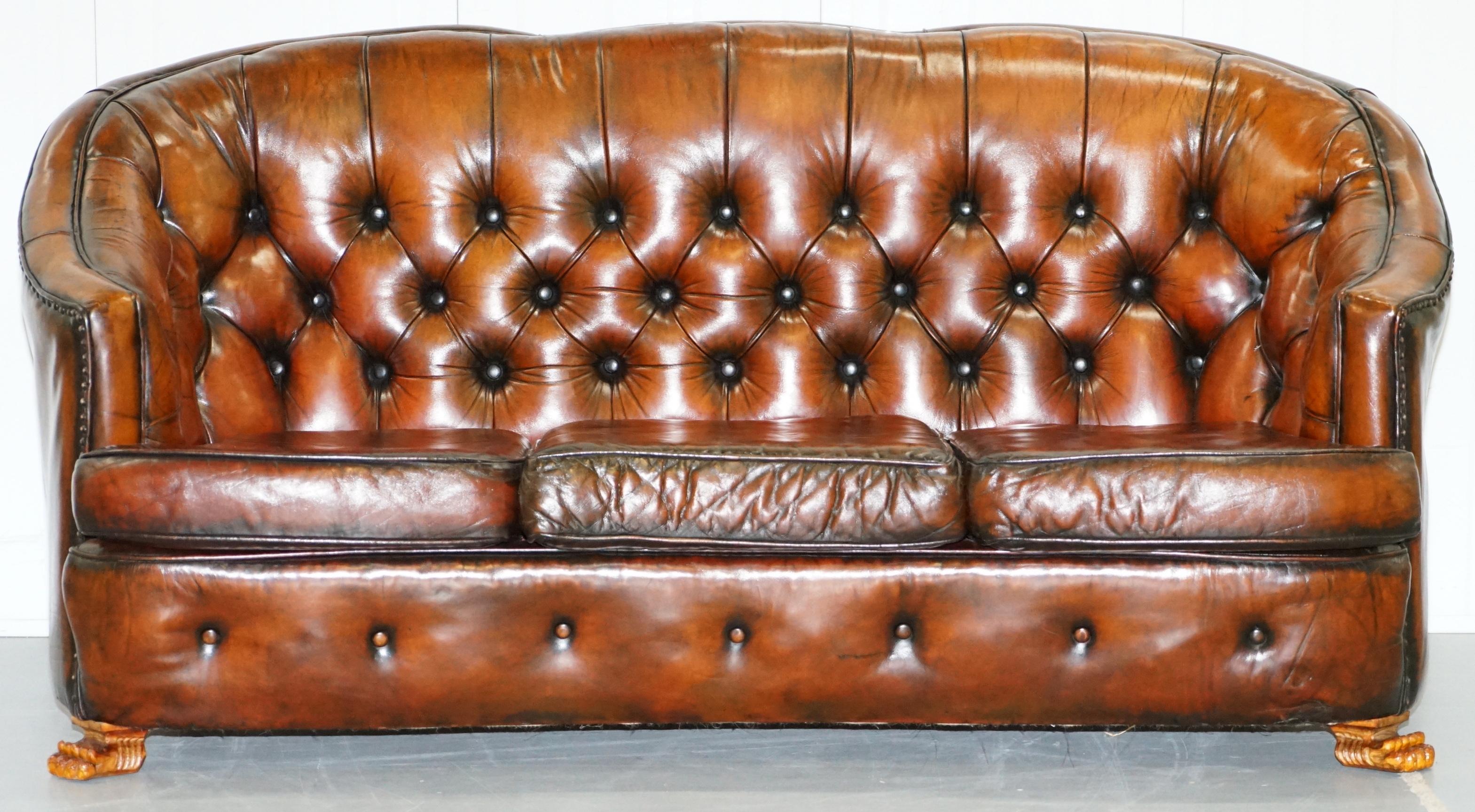 We are delighted to offer for sale this stunning very rare fully restored whisky brown leather Gentleman's club suite with hand-carved Lion hairy paw feet.

Where to begin! This suite is absolute eye candy from every angle, it is Victorian with
