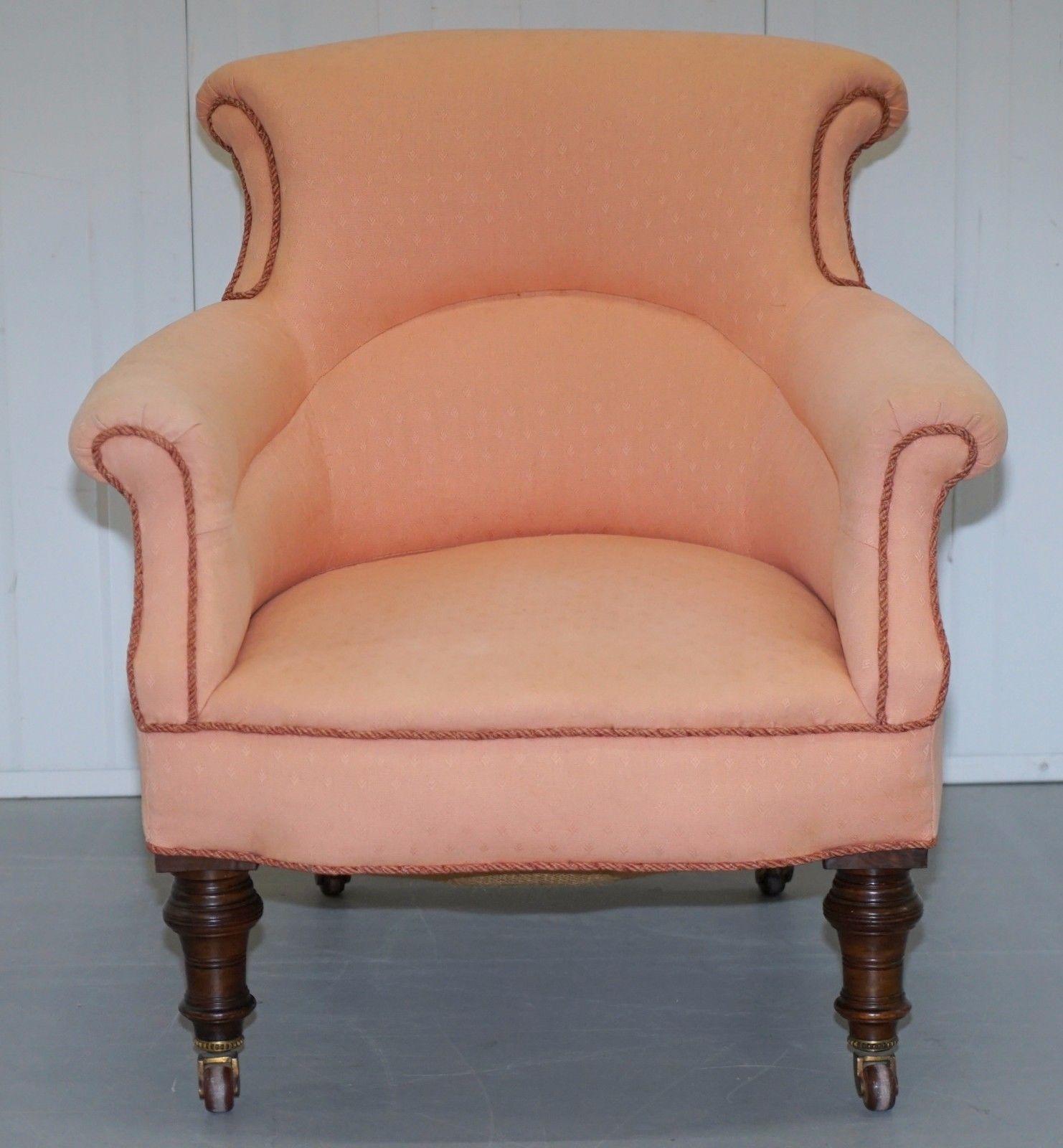 We are delighted to offer for auction this lovely original Druce & Co LTD of Baker Street London Victorian mahogany small tub armchair with samon pink upholstery.

All castors are original porcelain and fully stand Druce & Co London, this is a