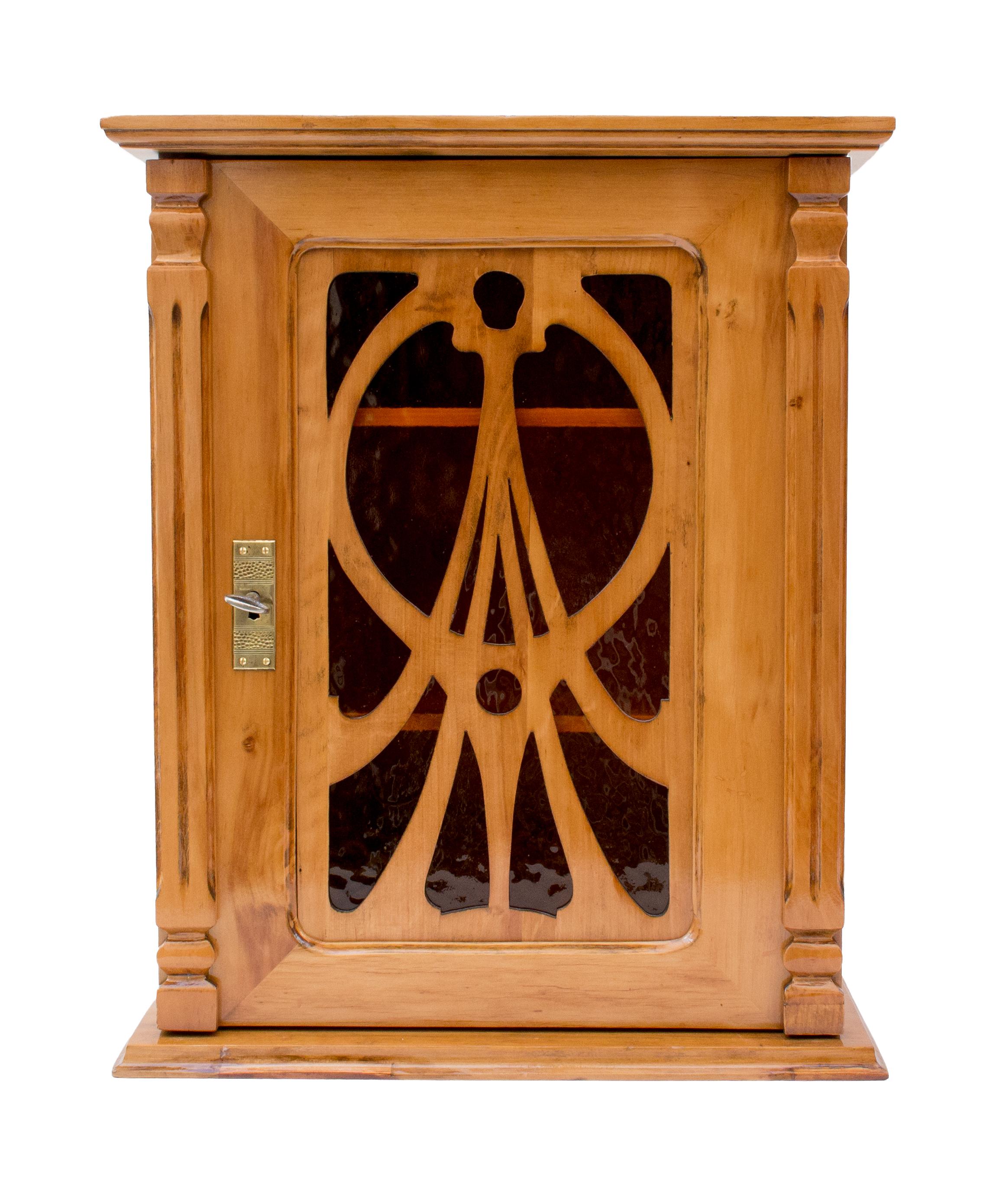 Beautiful hanging wall cabinet from the time of Art Nouveau made of solid plum wood made with the original orange Art Nouveau glass. In very good restored condition.