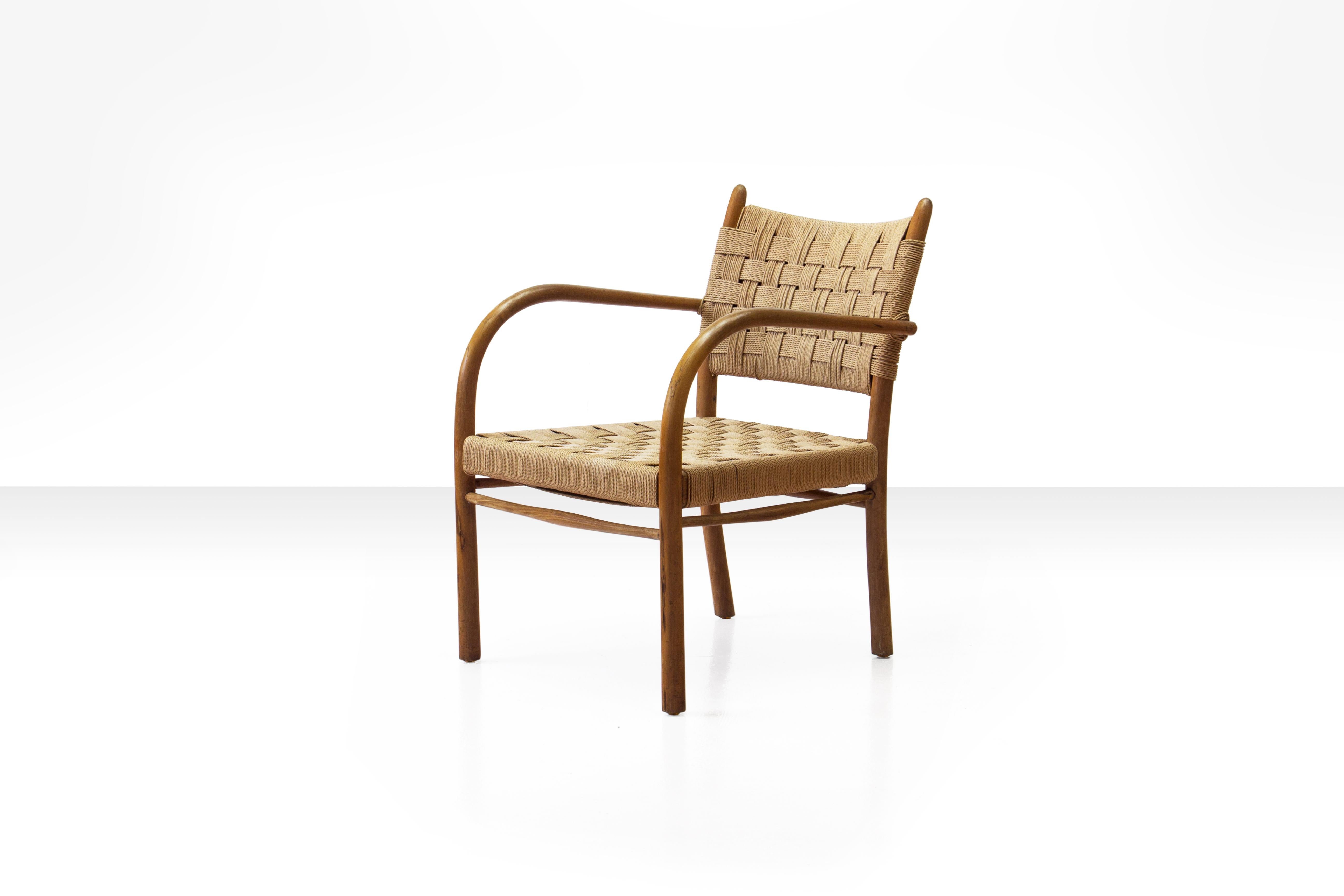 Beech armchair with woven papercord seat and back by K. Scröder, Denmark 1938. Model 1459. Manufactured by Fritz Hansen, 1930s-1940s.

Until recently this rare and sought after armchair was commonly attributed to Frits Schlegel. However a closer