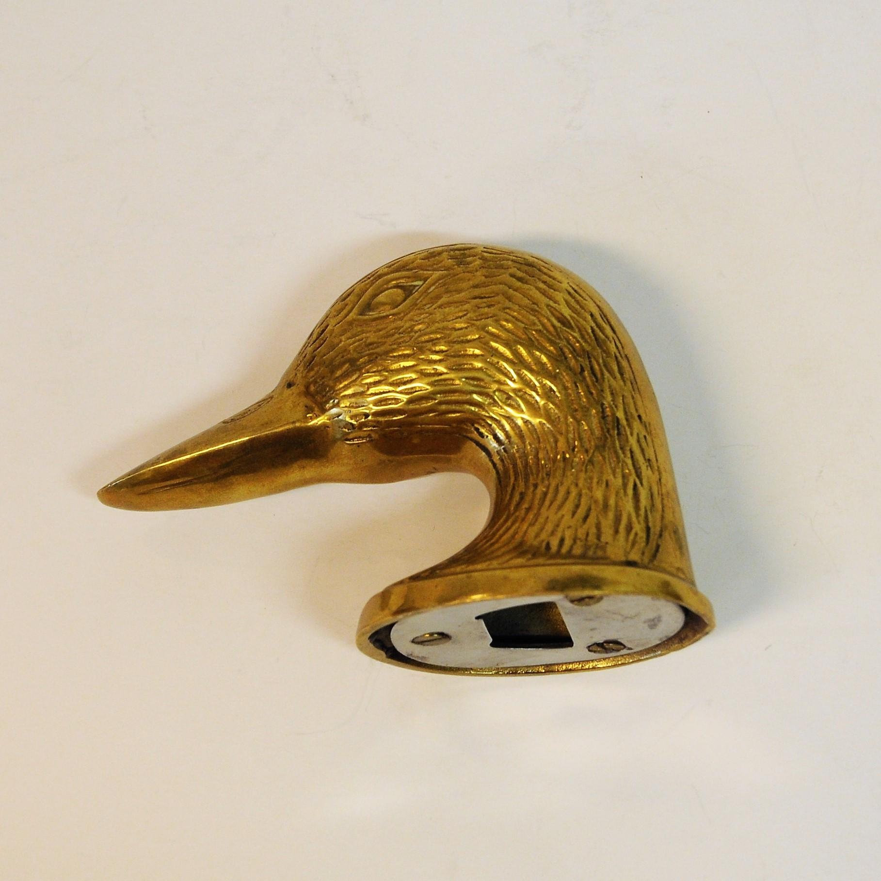 Very special and rare bottle opener of brass designed like a duck head. Nice grip. Looks good on the dining table as well. Measures: 8 cm height, diameter 5.5 cm x 6.5 cm, length 12 cm. 1970s.
 