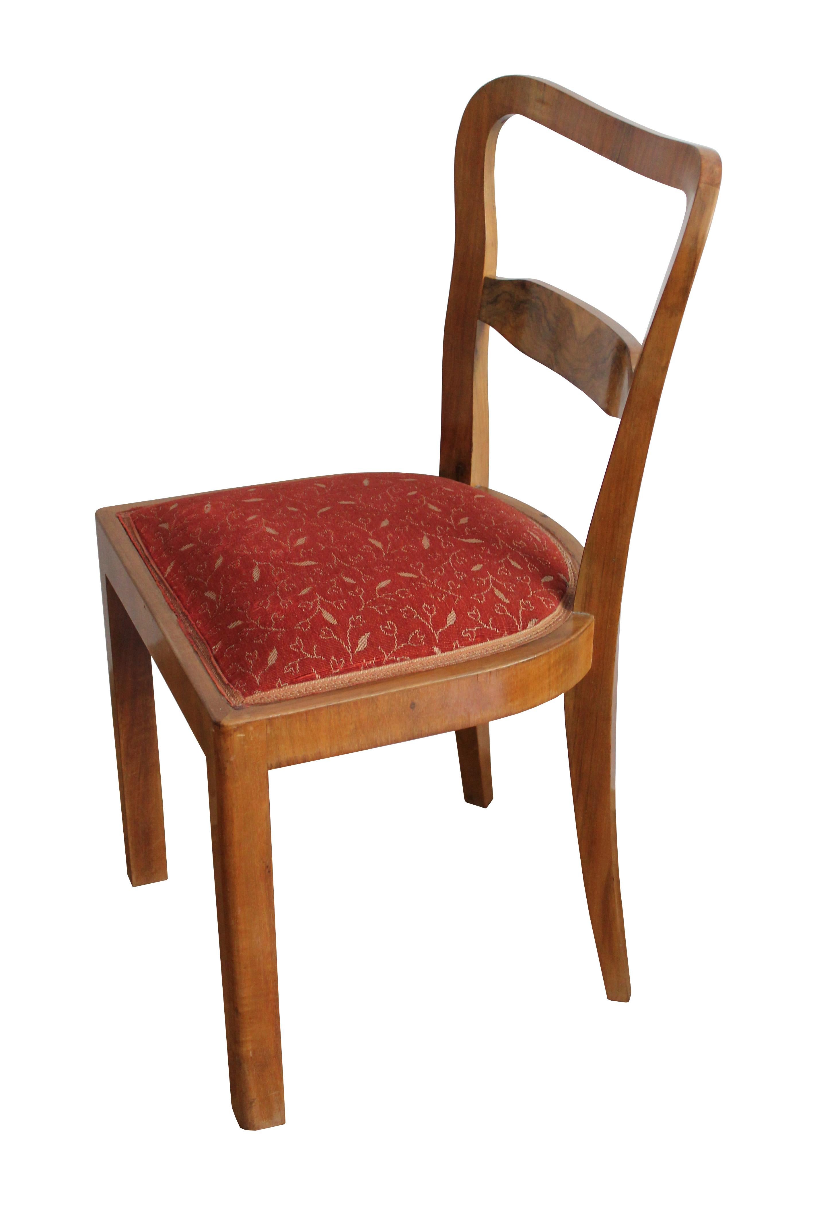 An unique set of four Art Deco dining chairs. They were made at the request for a private project of an employee of UP Brno in Czechoslovakia in the 1940s.                                    

The chairs are made of a combination of wood and