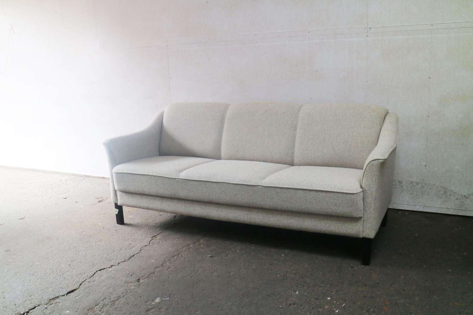 A beautiful Danish midcentury sofa, with the original ribbed woollen upholstery. In immaculate condition, with very firm cushioning. Classically designed with beautifully contoured arms. Sits on stained beech feet.

 