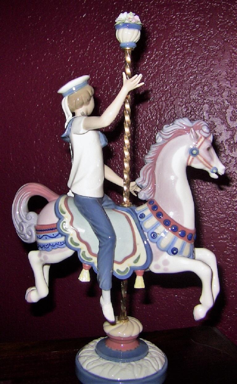 Lladro retired boy and girl on carousel. Simply stunning, rare and exception pair of Lladro figurines.
These two figurines were produced and sold individually and were titled 