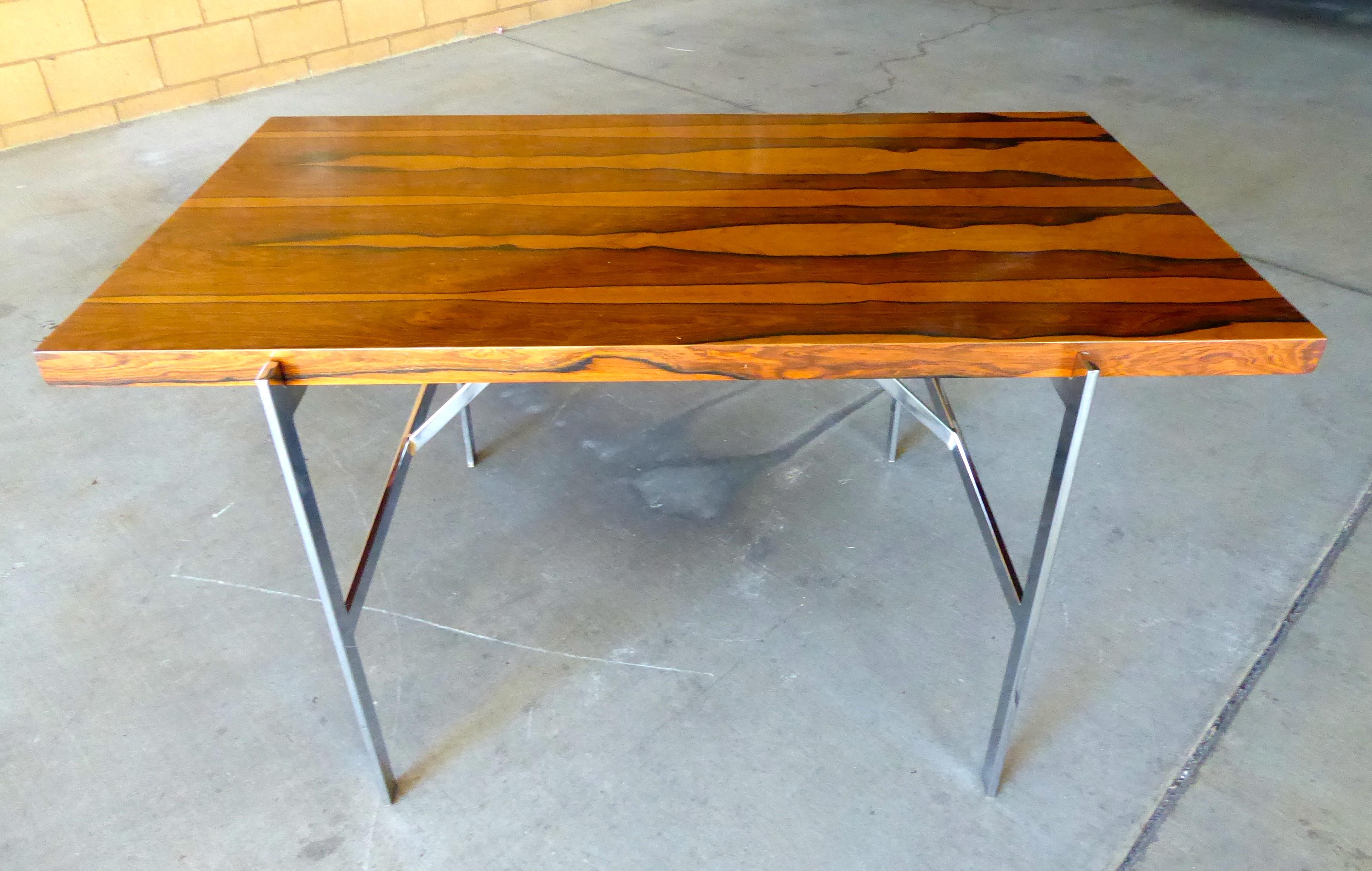 A figured rosewood and chrome-plated steel writing table designed by Milo Baughman for Thayer Coggin Institutional in the 1960s. This is possibly a rare design, as the institutional side of the Thayer Coggin brand is less well known. The