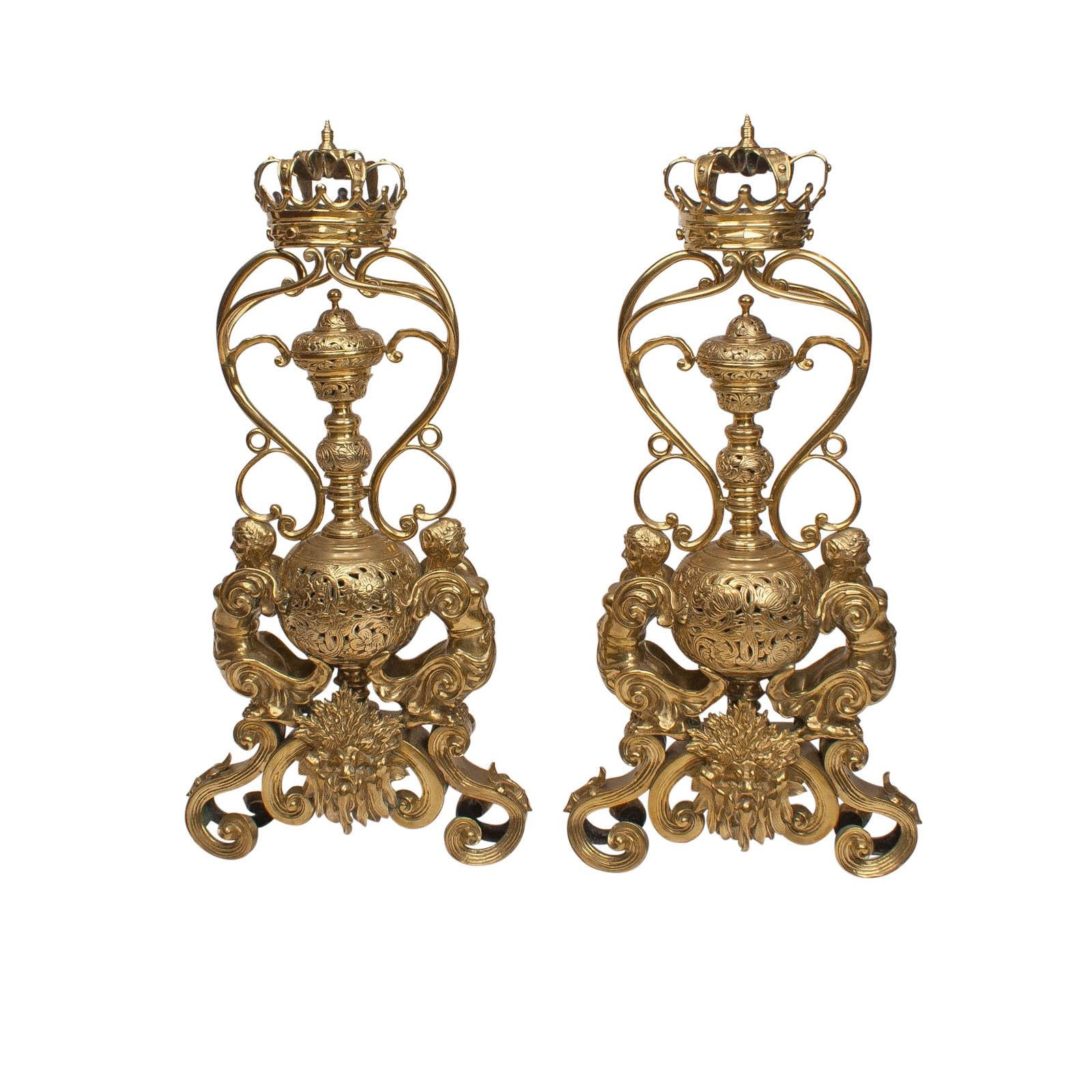 Hard to imagine a more ornate pair of andirons. These are brass and made in England, circa 1820. The crowns suggest noble provenance. The andirons have an incense container below the crown to 