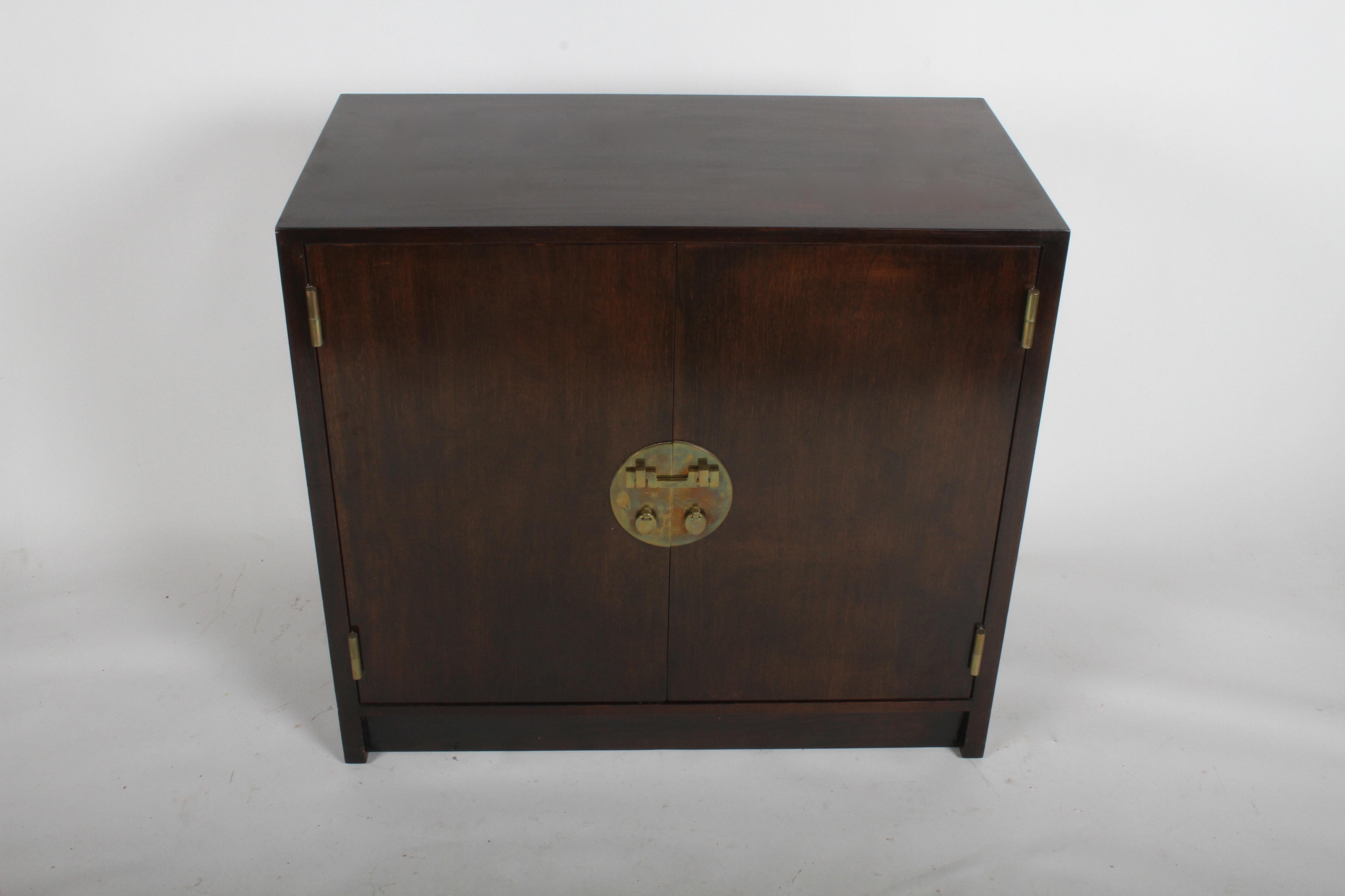 Mid-Century Modern Edward J. Wormley for Dunbar cabinet with brass Asian hardware. All original dark had rubbed finish on ribbon mahogany, top will be polished and touched up prior to shipping. It looks a little streaky, because I wiped it down