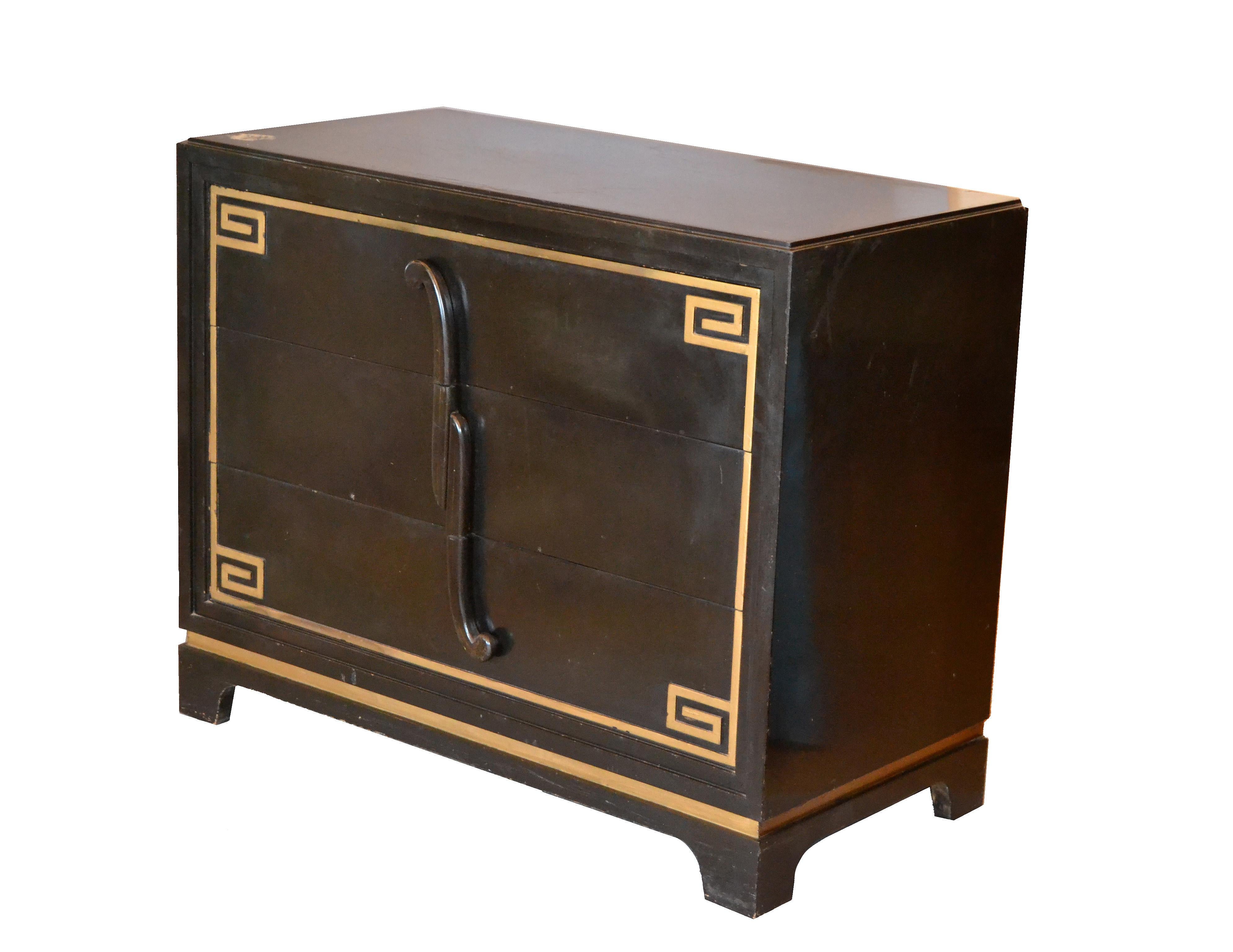 A matching pair of ebonized Greek key cabinets in the style of Grosfeld House with golden Greek key accents.
Each cabinet comes with three dovetailed drawers.
Note: The set needs to be restored.