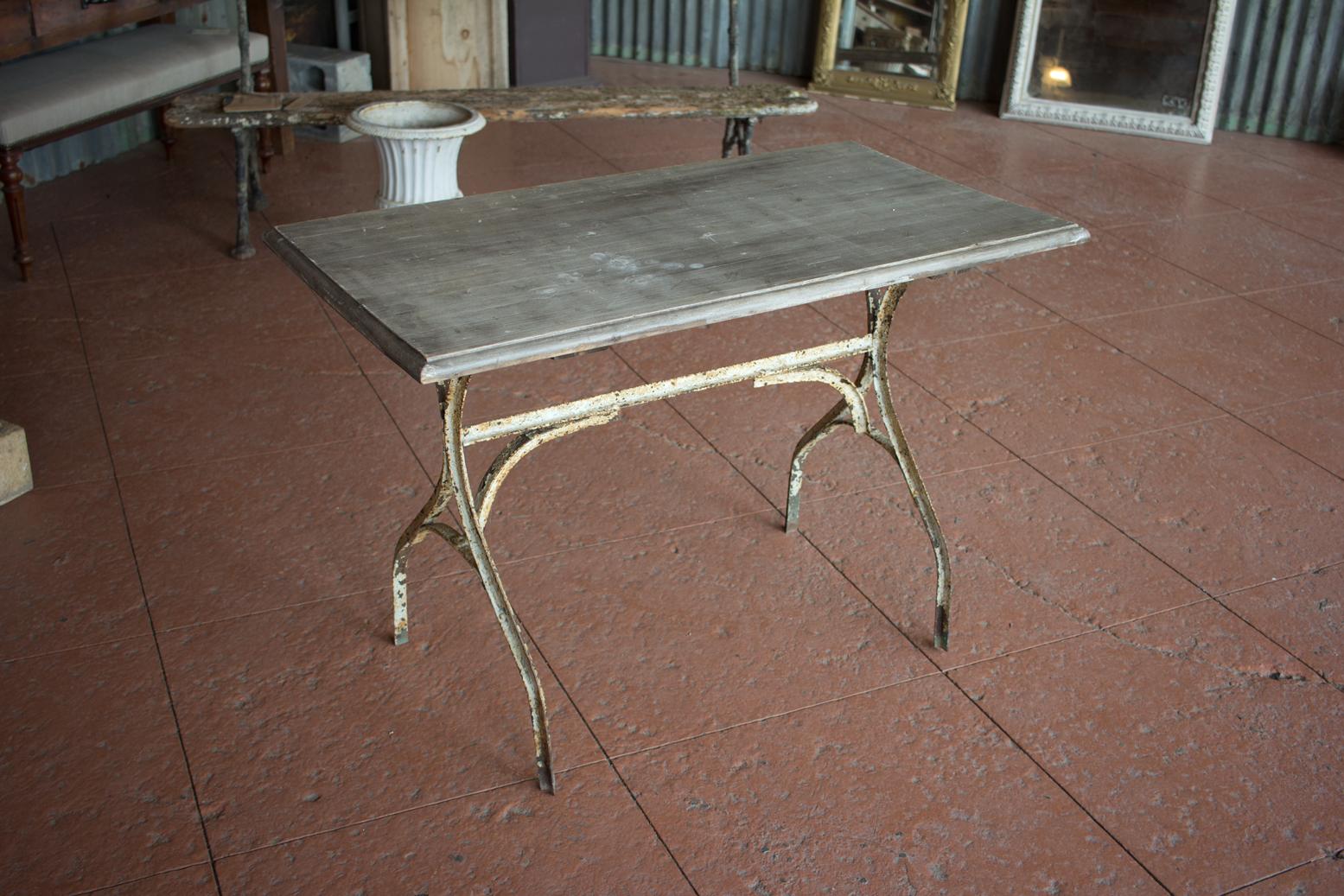Vintage French bistro table with original painted base and wood top. 

Lovely patina to base.