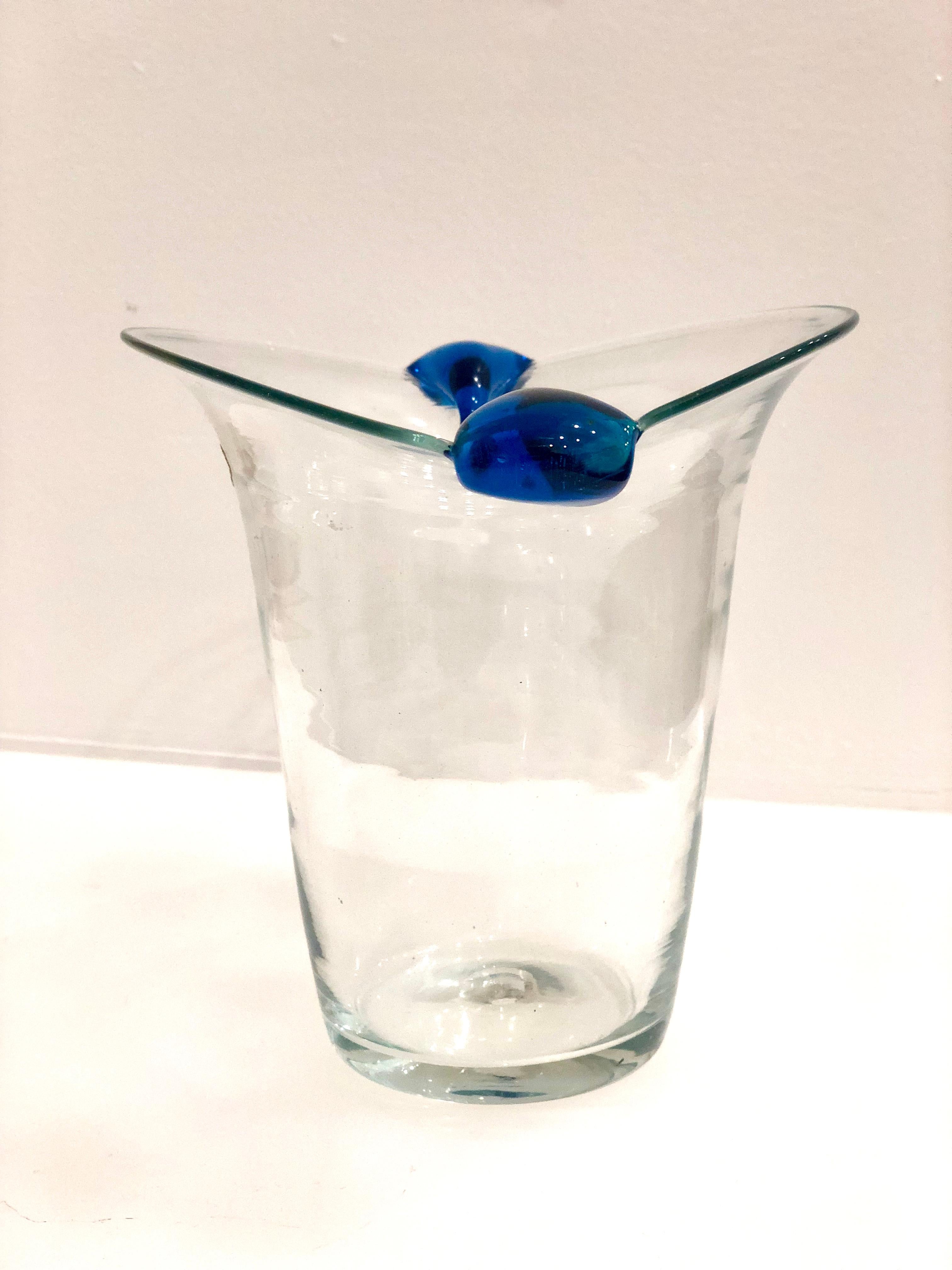 A beautiful 1960s handcrafted glass vase by Blenko. Has a clear finish with blue accents. In excellent condition, no chips or cracks. A very collectible and rare piece. Made by an American company.