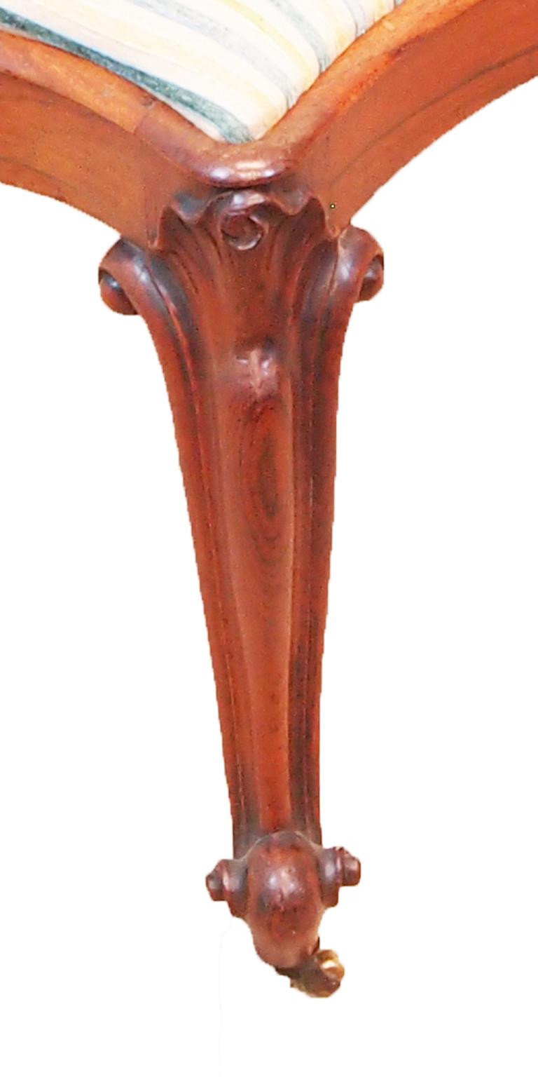A good quality mid-19th century rosewood stool
having shaped drop in seat and carved decoration
raised on elegant carved cabriole legs.