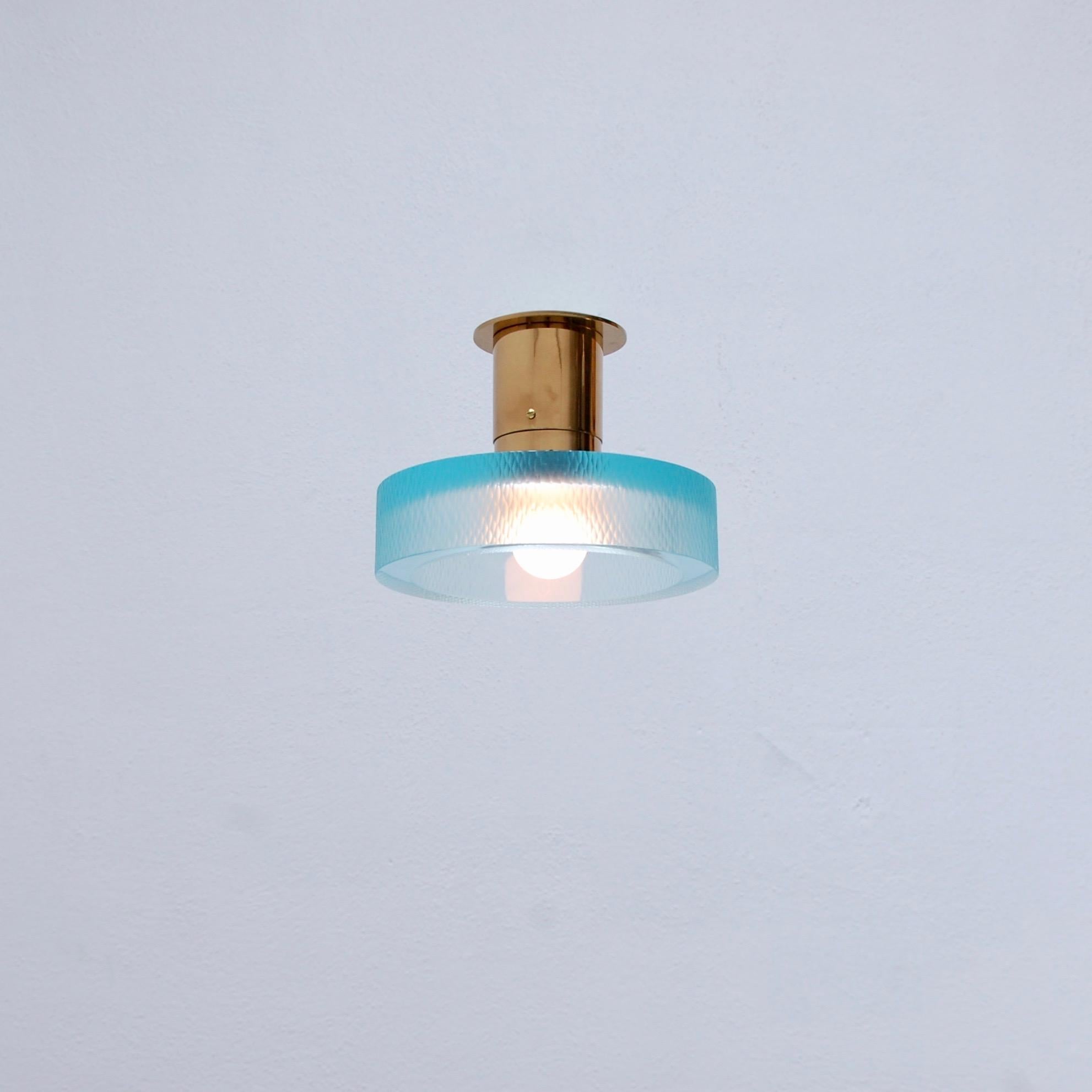 A classical Seguso Ceiling fixture from midcentury Italy in aqua marine glass and brass. Partially restored. (1) E26 medium based socket. In brass and glass. Priced individually. Light bulb included. Measurements:
Measure: Height 7”
Diameter 8.75”.
 