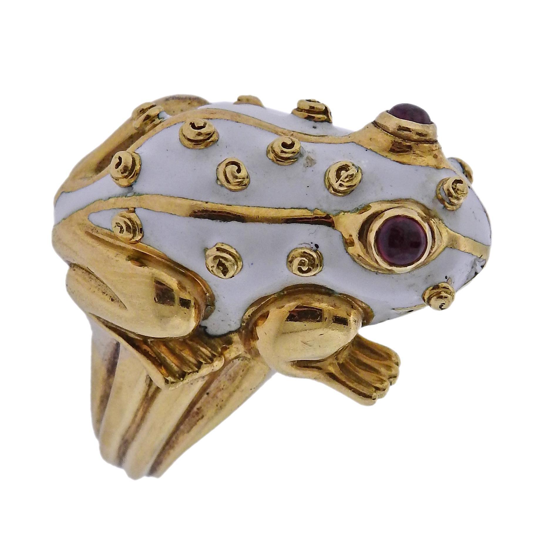 18k gold ring by David Webb, depicting white enamel frog, set with ruby cabochon eyes. Retail $9500. Ring size - 4.25, ring top is 25mm x 17mm, weighs 20.3 grams. Marked: Webb, 18k.