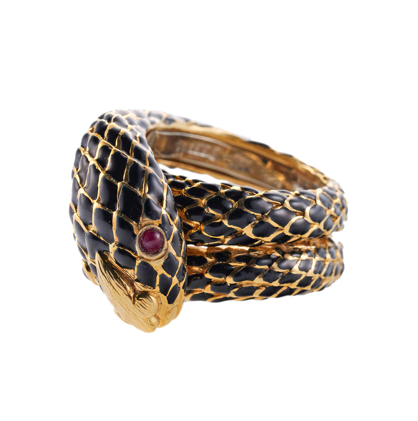 David Webb 18K yellow gold and black enamel wrap snake ring set with ruby eyes. Ring size 6, top measures 20mm wide. Marked: Webb, 18k. Weight is 25.7 grams.