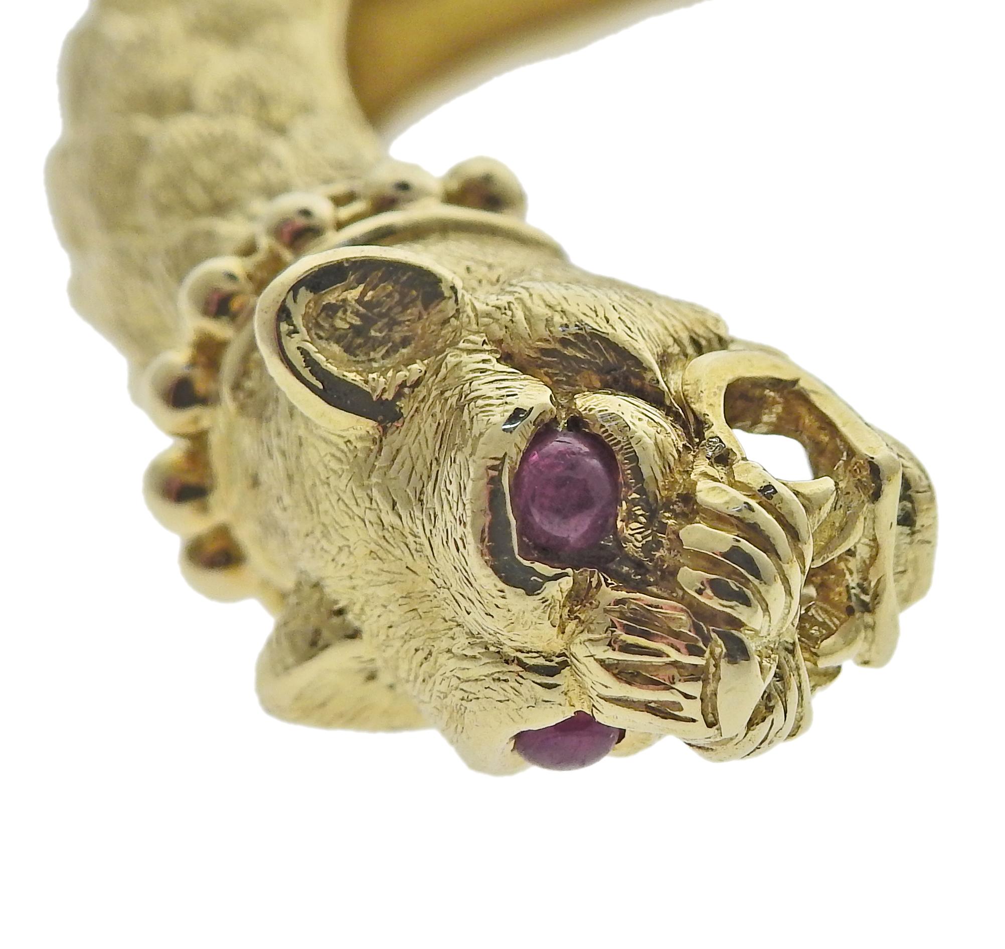 David Webb 18k gold leopard cuff bracelet with ruby eyes. Bracelet will fit approx. 7