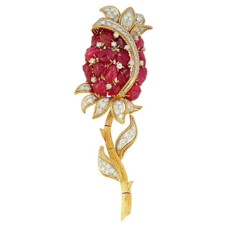 David Webb Ruby Rose Flower Brooch

Carved rubies & 73 round cut diamonds forming a rose set in 18k gold & platinum.

Measurements: 3.75
