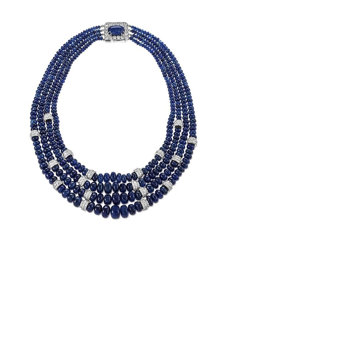 n American Late-20th Century platinum and 18 karat white gold necklace with sapphires and diamonds by David Webb. The necklace is composed of graduating sapphire beads with an approximate total weight of 500 carats, completed by a cabochon sapphire
