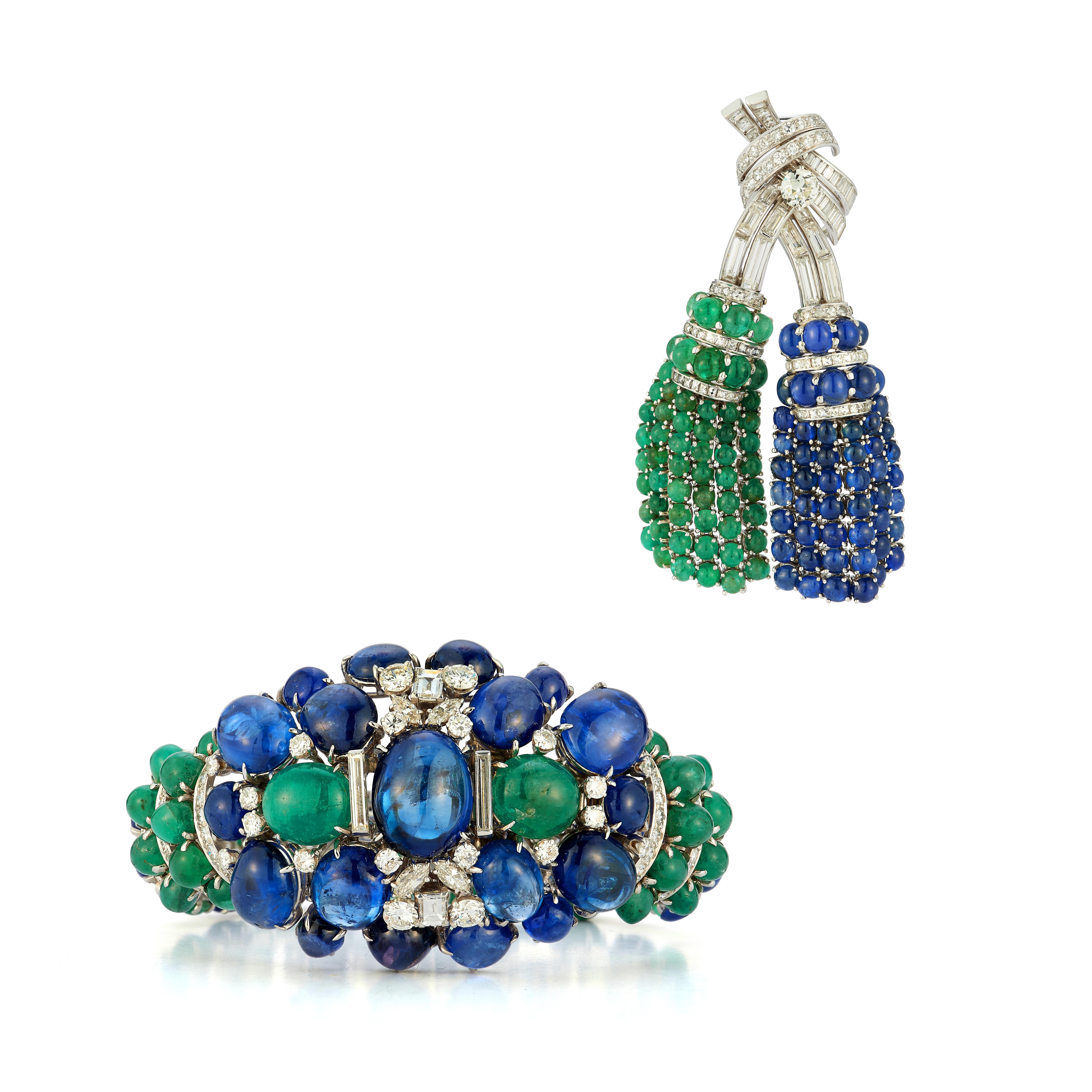 David Webb Sapphire & Emerald Bracelet & Brooch Set

Bracelet:
Made of platinum and 18 karat white gold set with 43 cabochon sapphires, the largest of which is approximately 20 carats, 44 cabochon emeralds, and 179 multi cut diamonds.

Signed David
