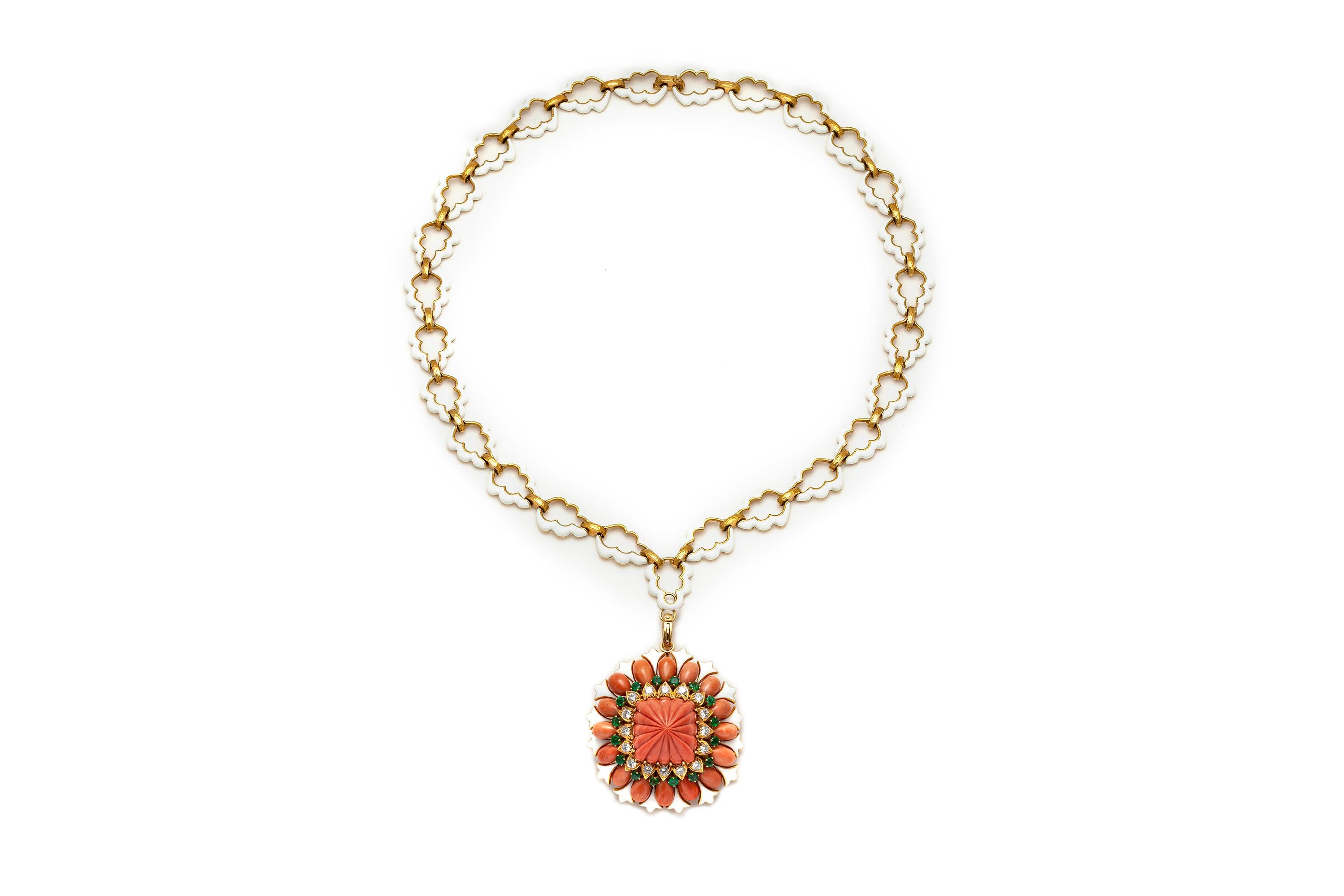 Finely crafted in 18k yellow gold and white enamel with carved Coral, Round Brilliant cut Diamonds weighing approximately a total of 4.00 carats, and Round cut Emeralds weighing approximately a total of 5.00 carats.
Signed by David Webb
The pendant