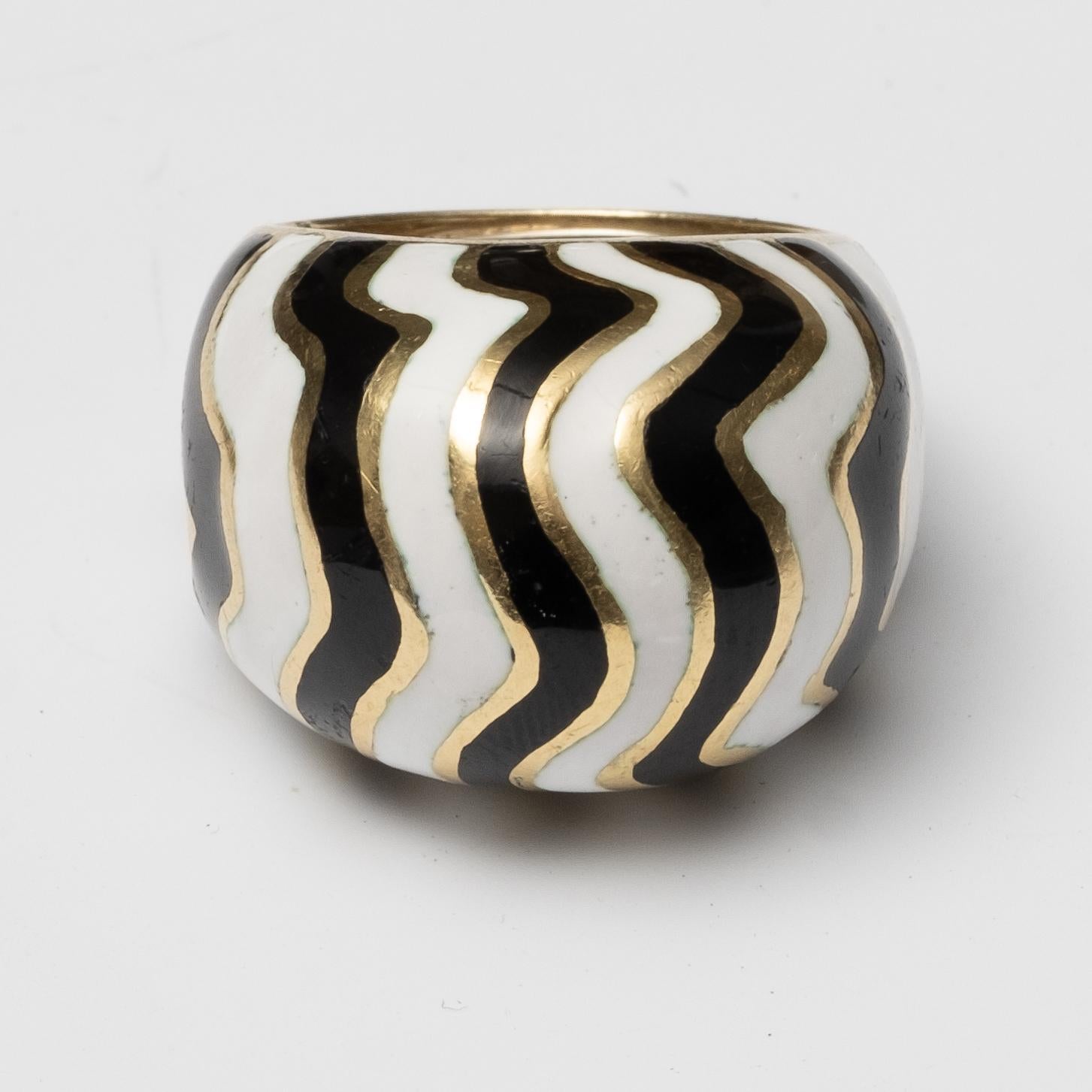 David Webb authentic and Signed 18K Yellow gold with white and black enamel in a zebra stripe pattern. Ring is Stamped David Webb. Size 6 and weighs 29.4 grams..looks great and in perfect condition