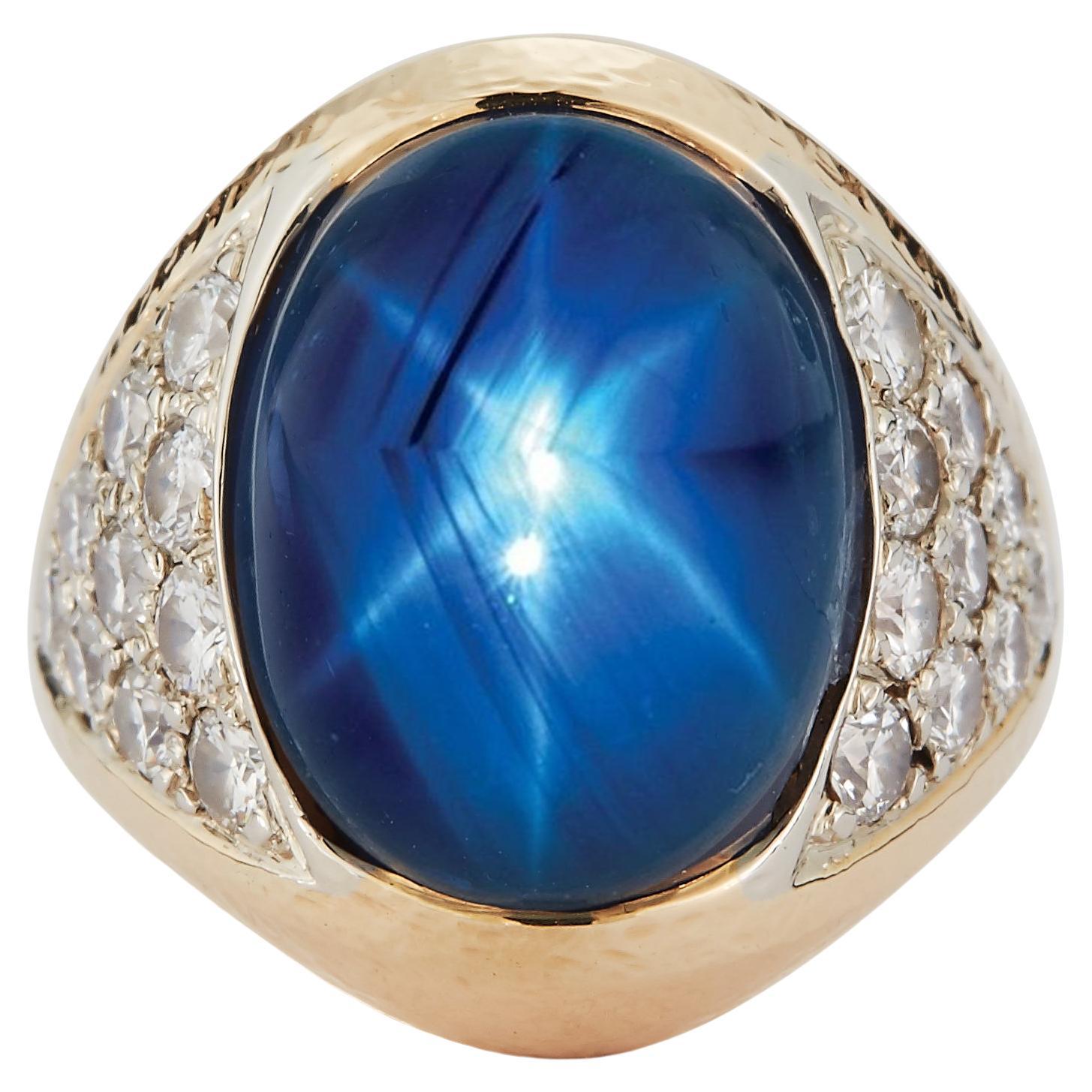 David Webb Star Natural Star Sapphire & Diamond Ring

This magnificent ring by David Webb showcases a majestic natural star sapphire, radiating deep celestial blue hues, highlighted by shimmering diamond pavé accents. Expertly crafted in 14k yellow