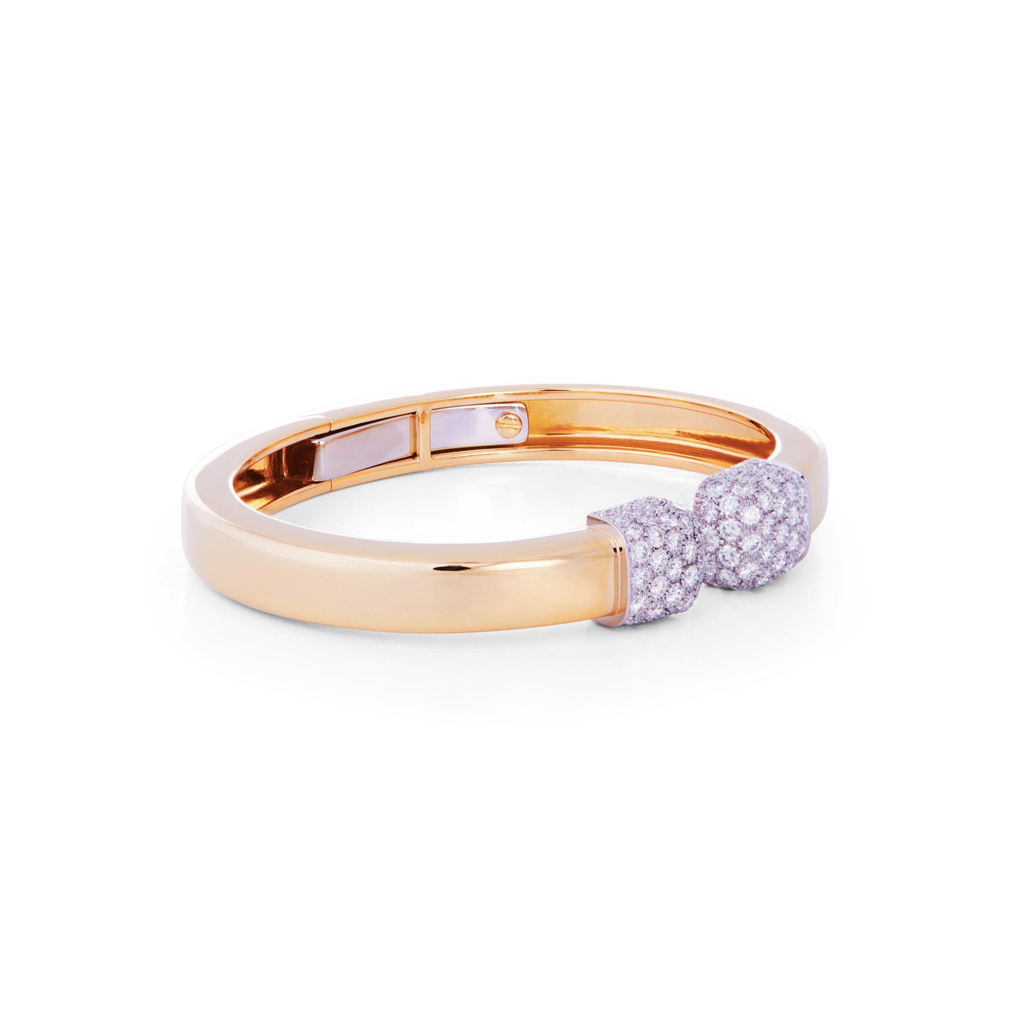 Authentic David Webb Sugar Cube bracelet crafted in 18 karat gold.  The hinged bangle is finished by diamond-set platinum ends for an estimated 2.75 carats total weight. The bracelet measures .39 inches at the widest point with a 6 inch internal
