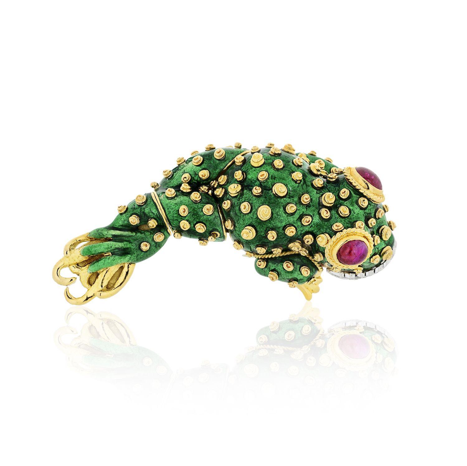 Gold, Platinum, Green Enamel, Ruby and Diamond Tadpole Brooch, David Webb
18 kt., the stylized tadpole applied with green enamel and applied gold spiral spots, with two collet-set oval cabochon ruby eyes further edged by twisted gold, its platinum