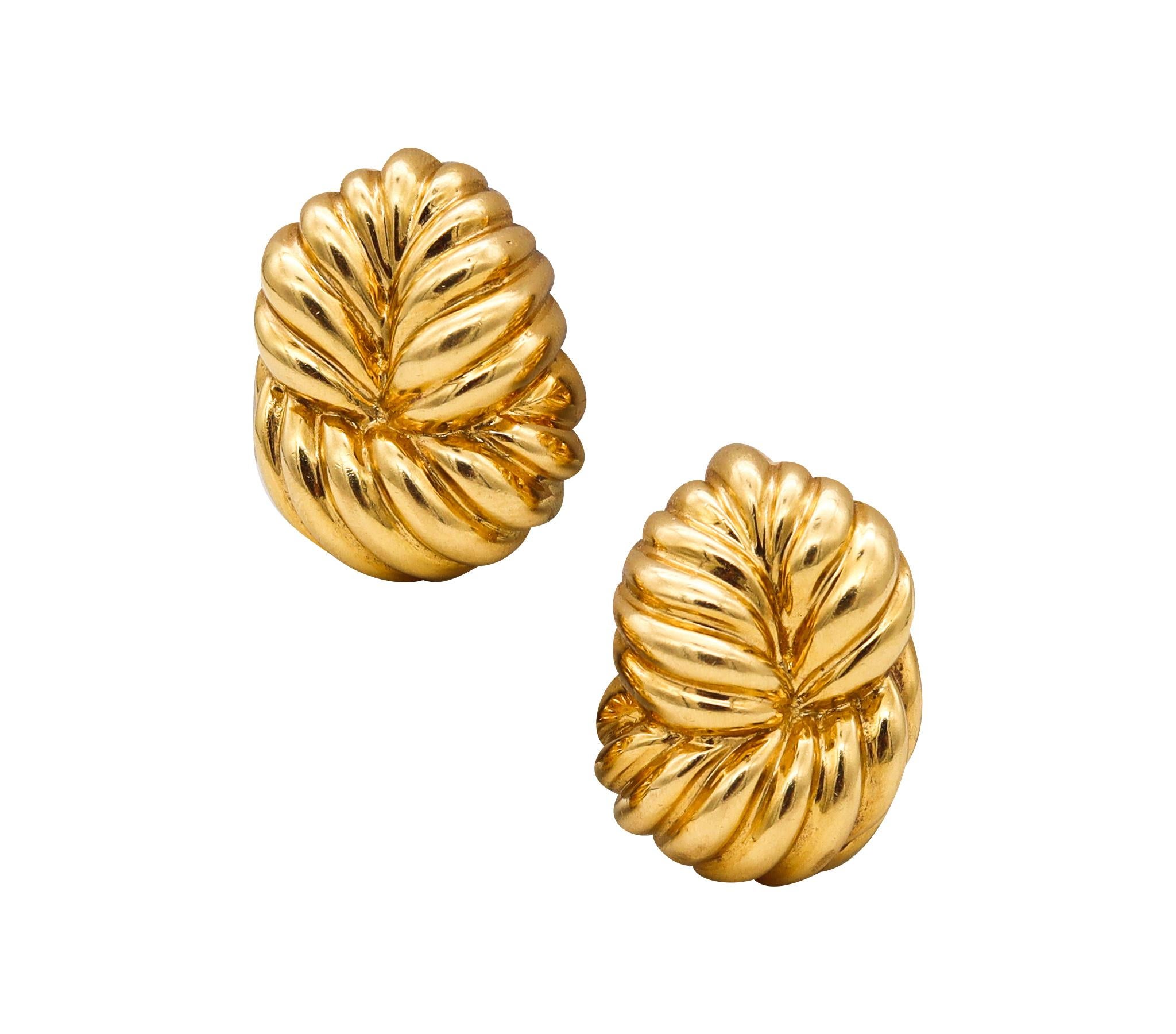 Pair of clips earrings designed by David Webb (1925-1975).

A vintage pair, made in New York city at the atelier of David Webb, back in the late 1970's. These pair of clip-on earrings was crafted with a fluted shape, in solid rich yellow gold of 18