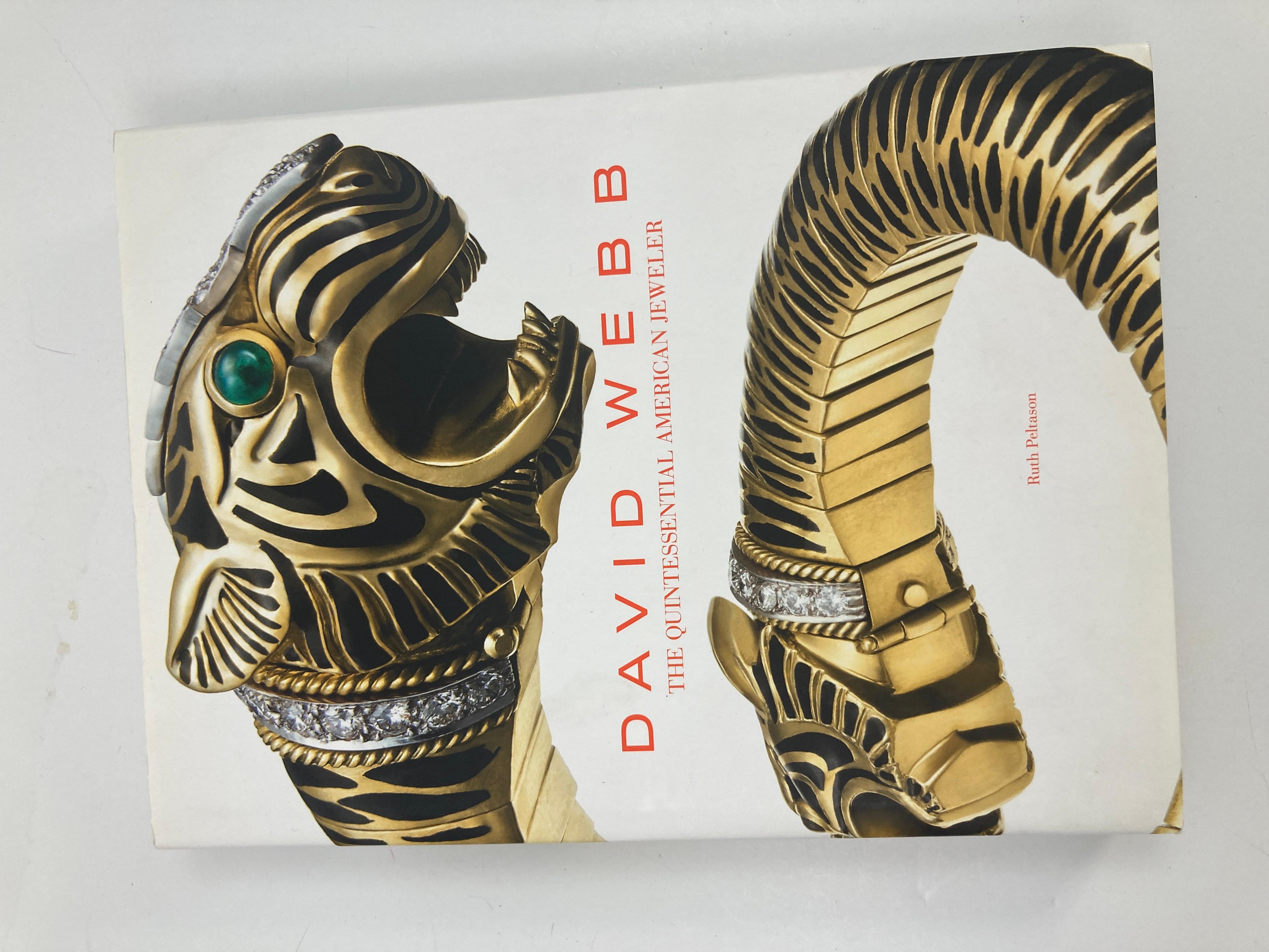 David Webb The Quintessential American Jeweler hardcover book by Ruth Peltrason c 2013.
This large heavy hardcover luxury book is an amazing archive of Webb's extraordinary 20th century jewelry designs Webb is best known for his enchanting animal