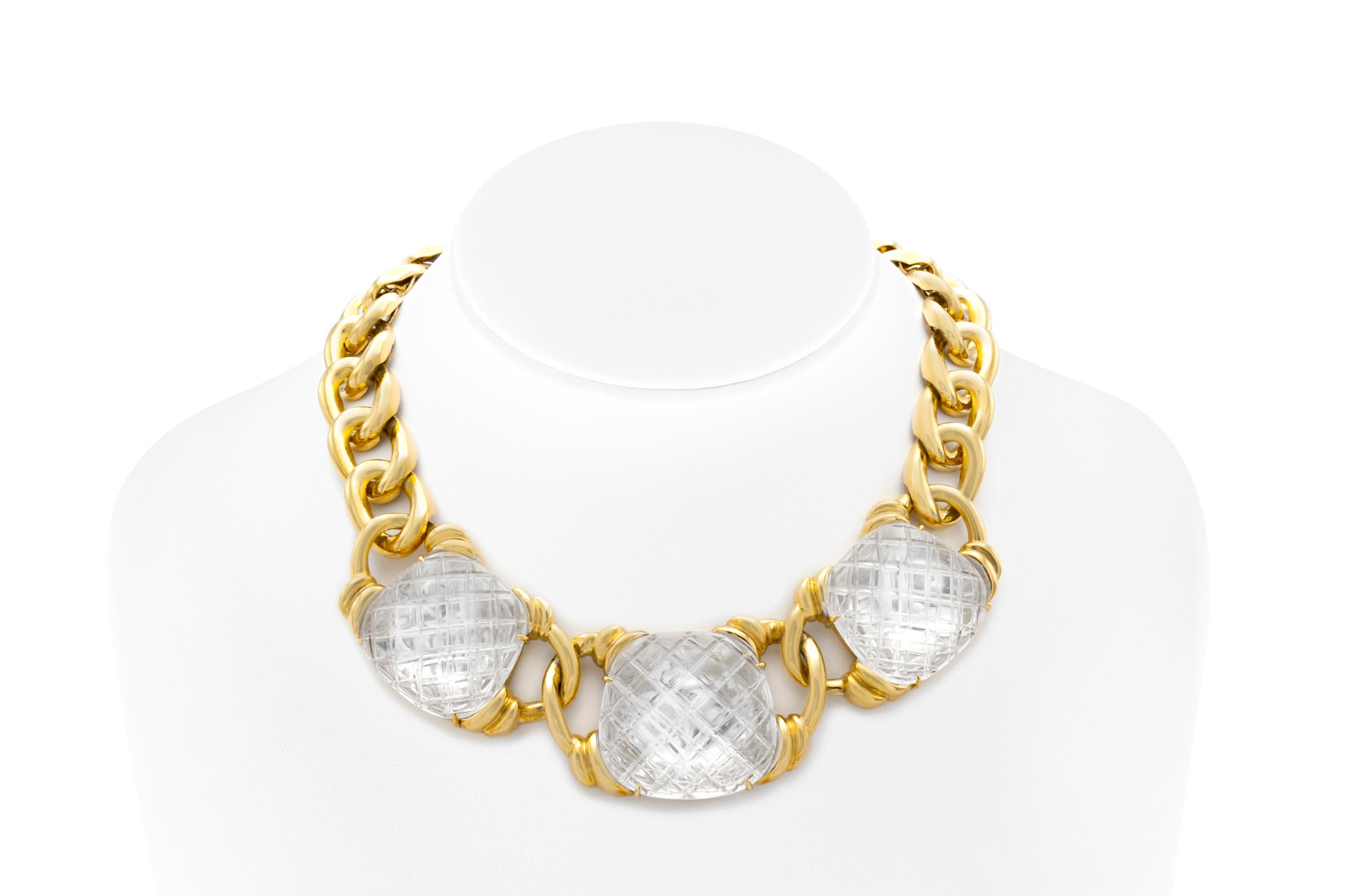 Finely crafted in 18k yellow gold with three cross-hatched rock crystals.
Signed by David Webb.
16 inches