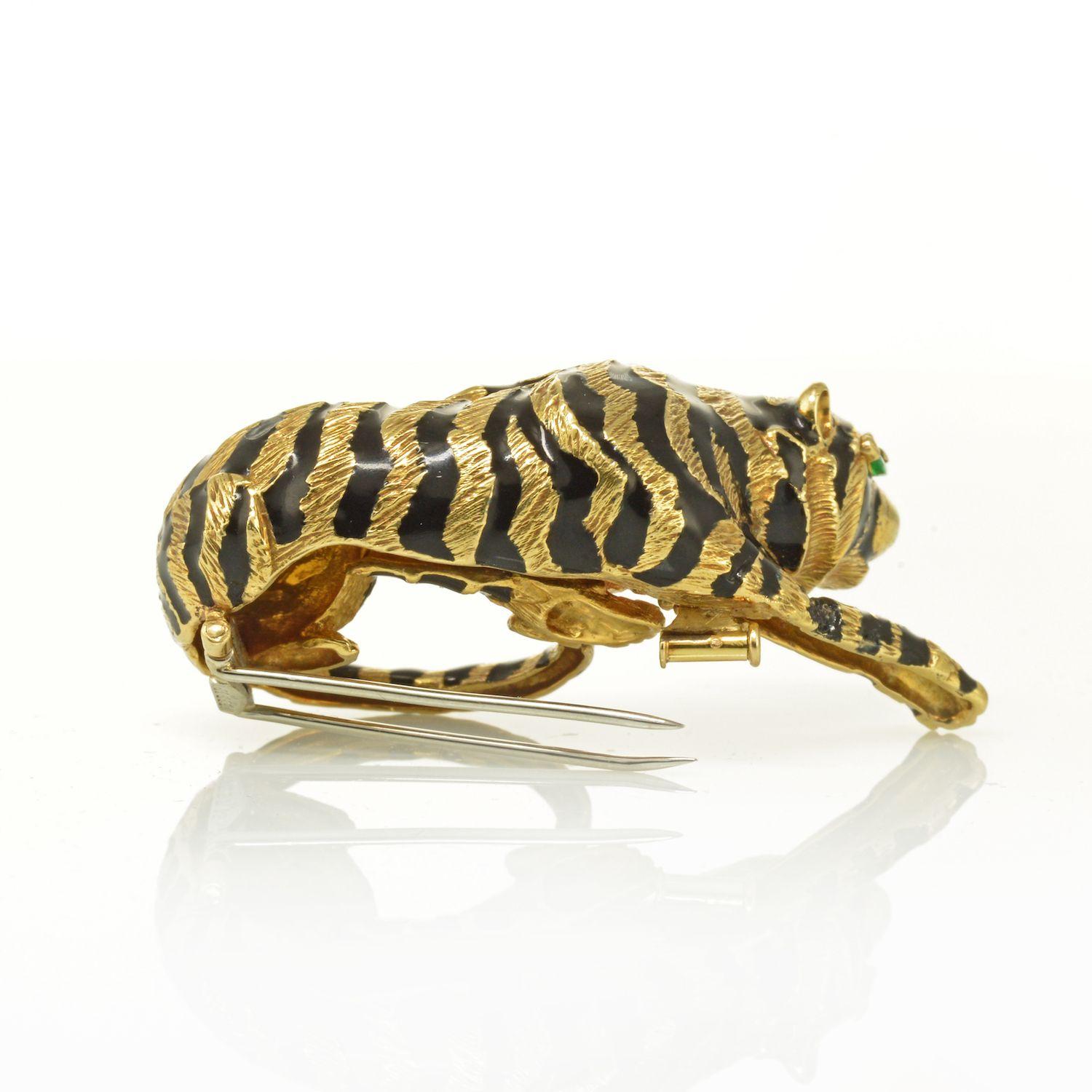 David Webb's iconic creations are hallmarked by his illustrious animal-themed jewels. This substantial brooch measures 2.5 by 1.25 inches and offers an exceptional rendering of a tiger, his golden fur textured with masterful skill and his glossy