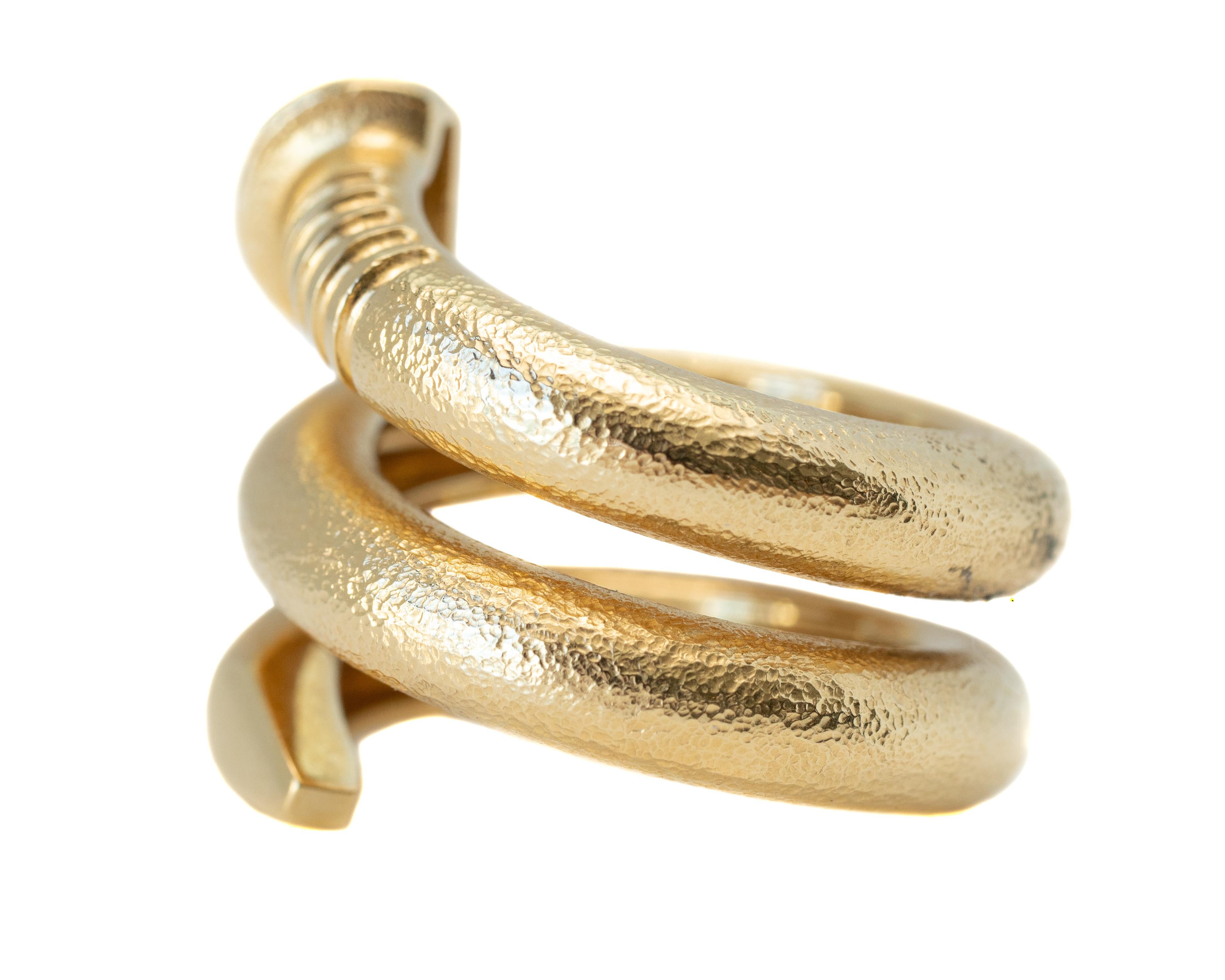 David Webb Tool Chest Hammered Nail Ring - 18 karat Yellow Gold

Features:
From the David Webb Tool Chest Collection
Twisted Nail Design 
Wrap Ring
18 karat Yellow Gold Hammered Finish
Finger to top of ring measures 4 - 7 millimeters
Ring Width